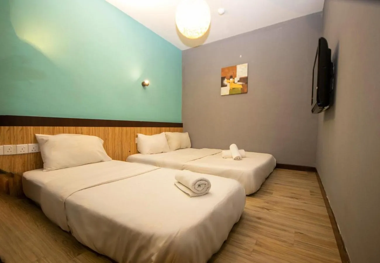 Bed in JQ Station Eight Inn