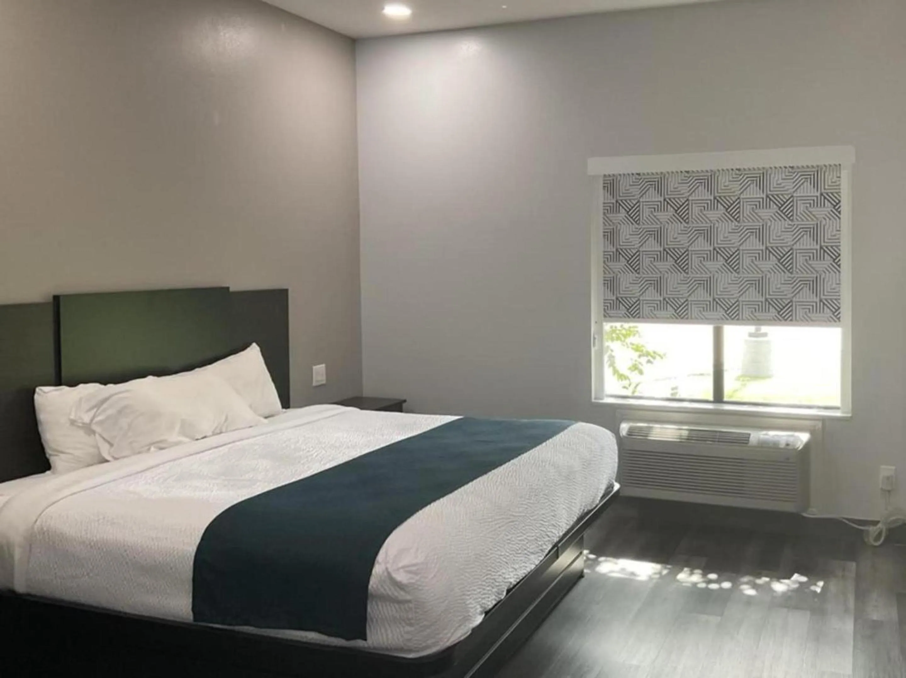 Bed in Studio 6 Suites Brenham, TX