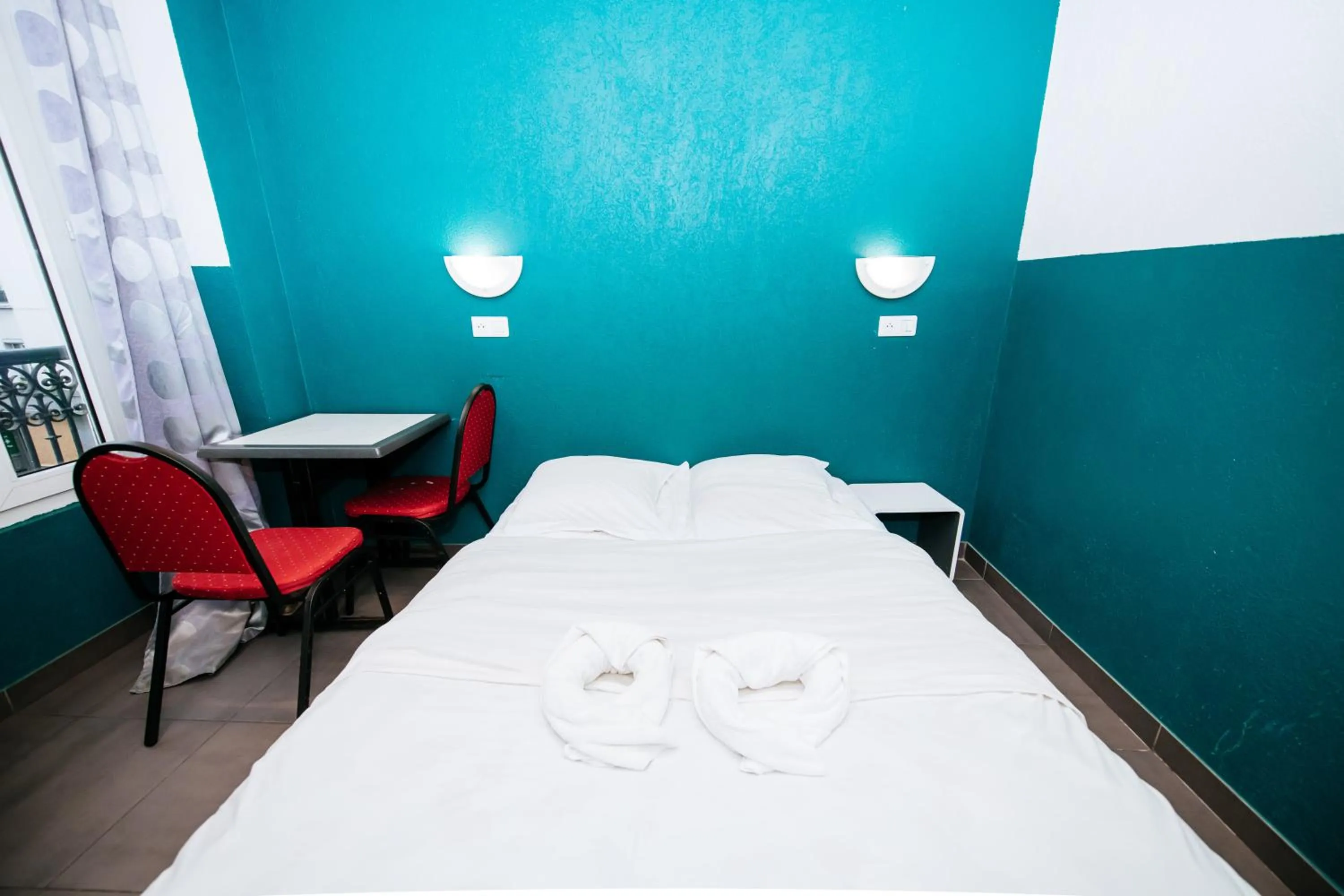 Bed in Hotel De La Poste