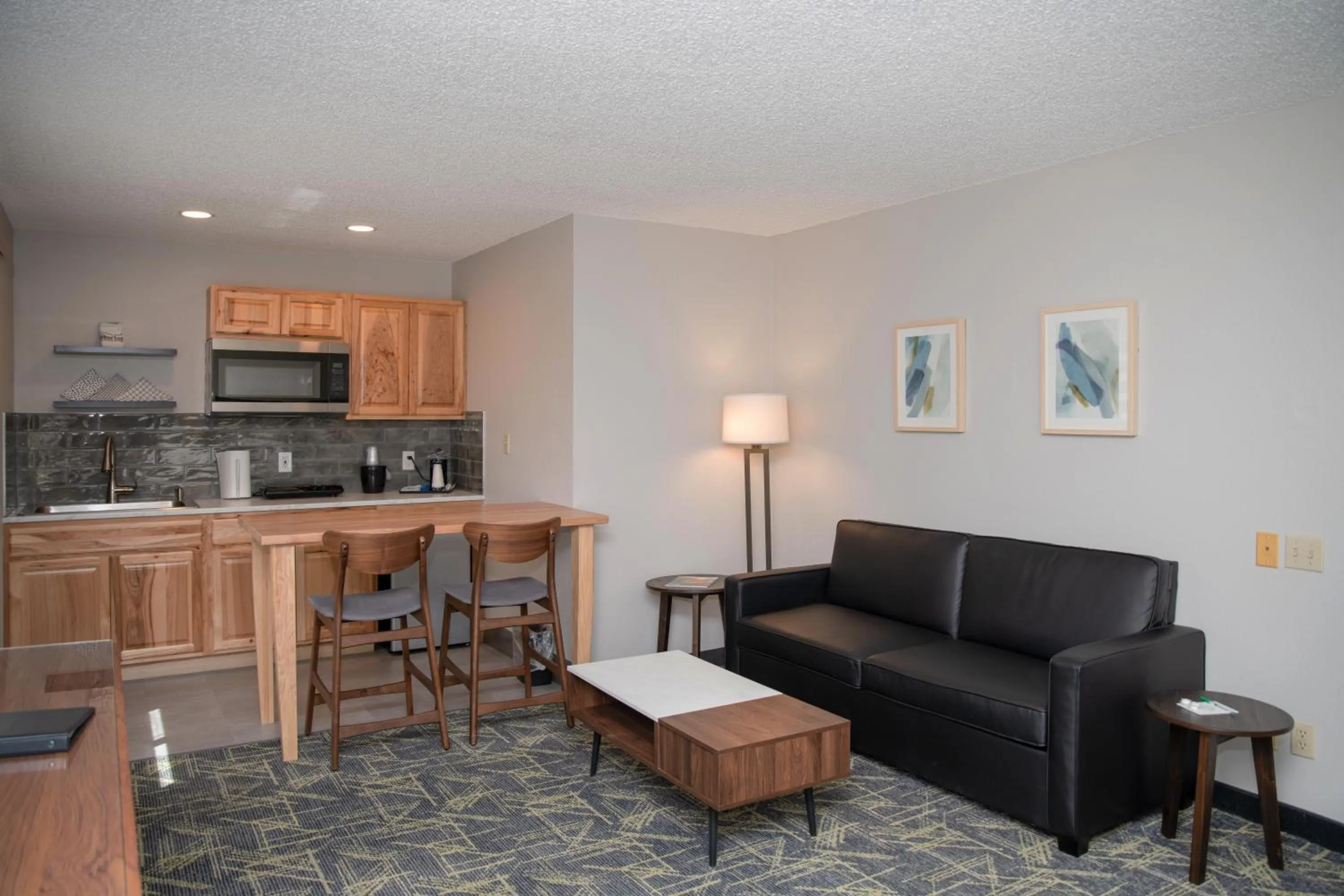 Living room in SureStay Plus by Best Western Montrose
