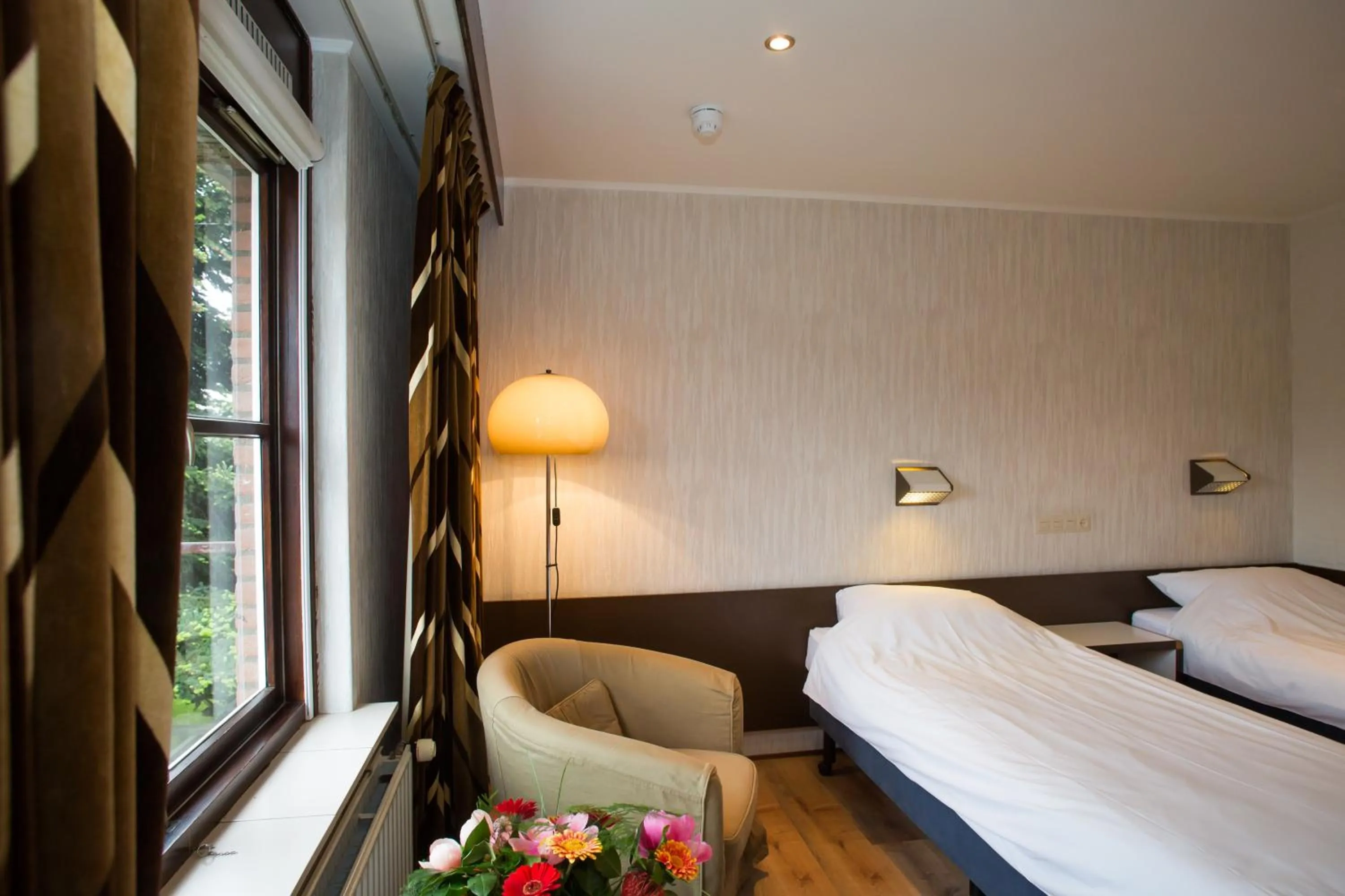 Bed in Landhotel De Hoofdige Boer