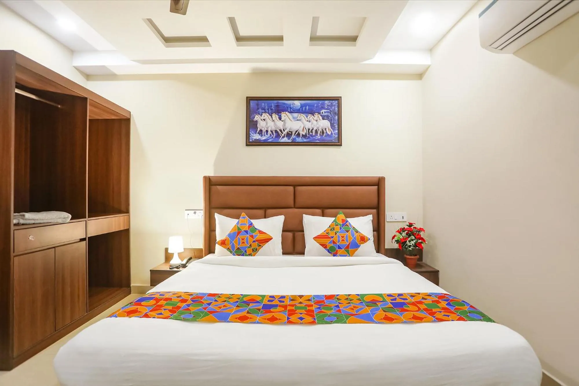 Bed in FabHotel Nirvana Residency