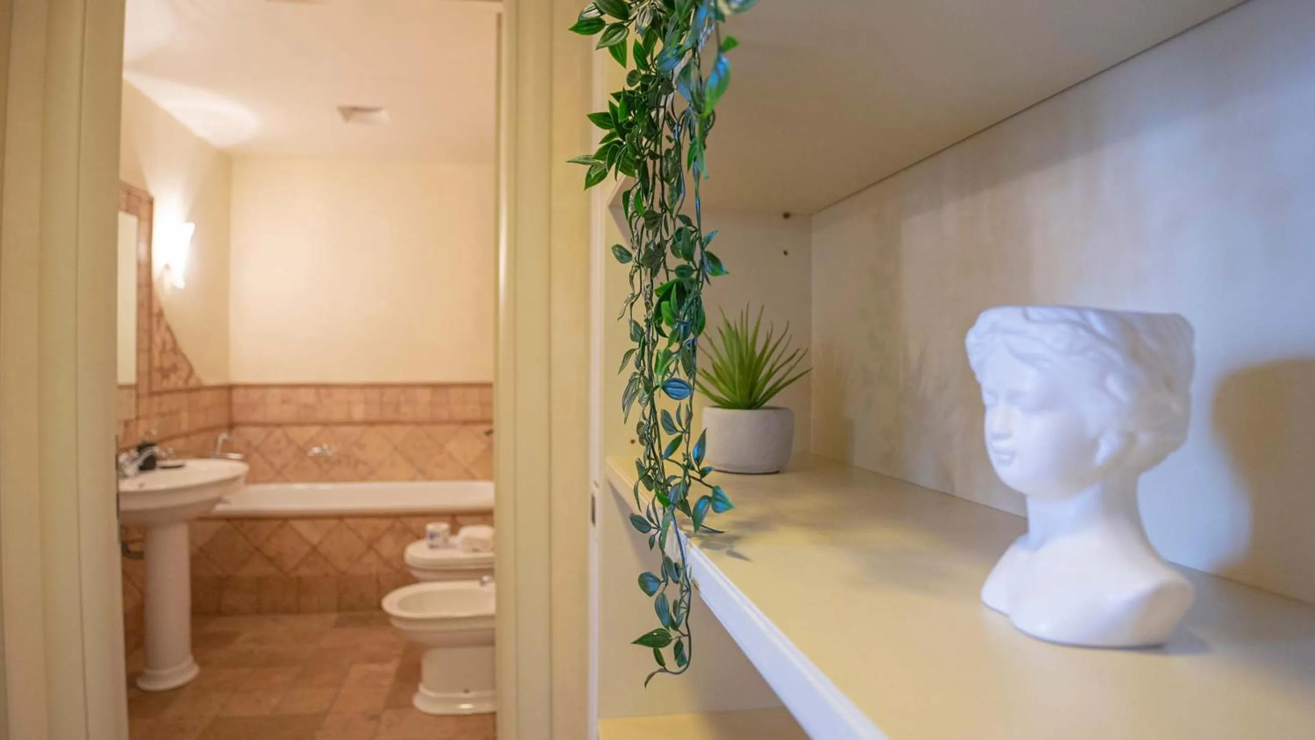 Bathroom in EasyTopStay - Piazza Venezia City View Charming Apt