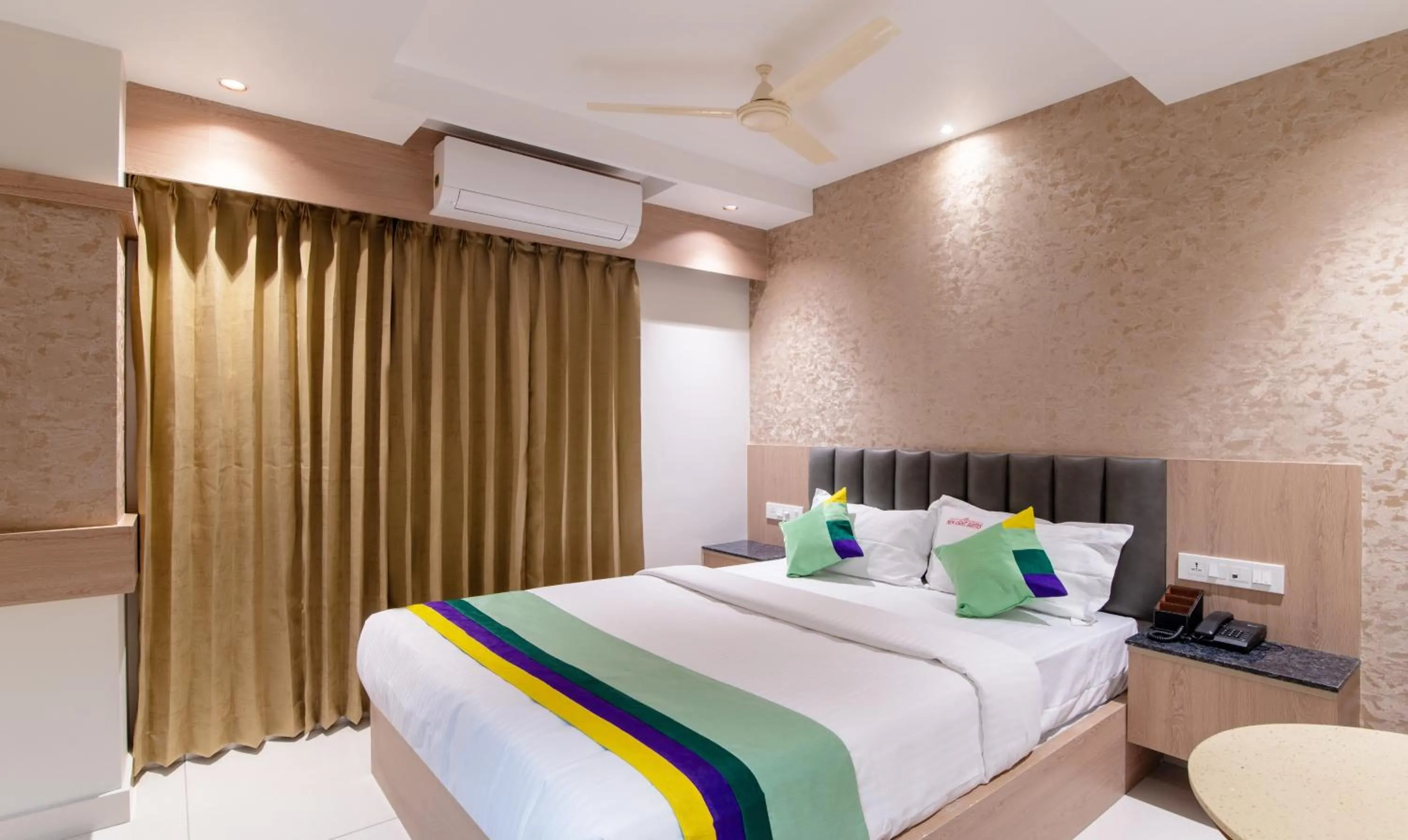 Bedroom, Bed in Treebo Premium New Light Suites