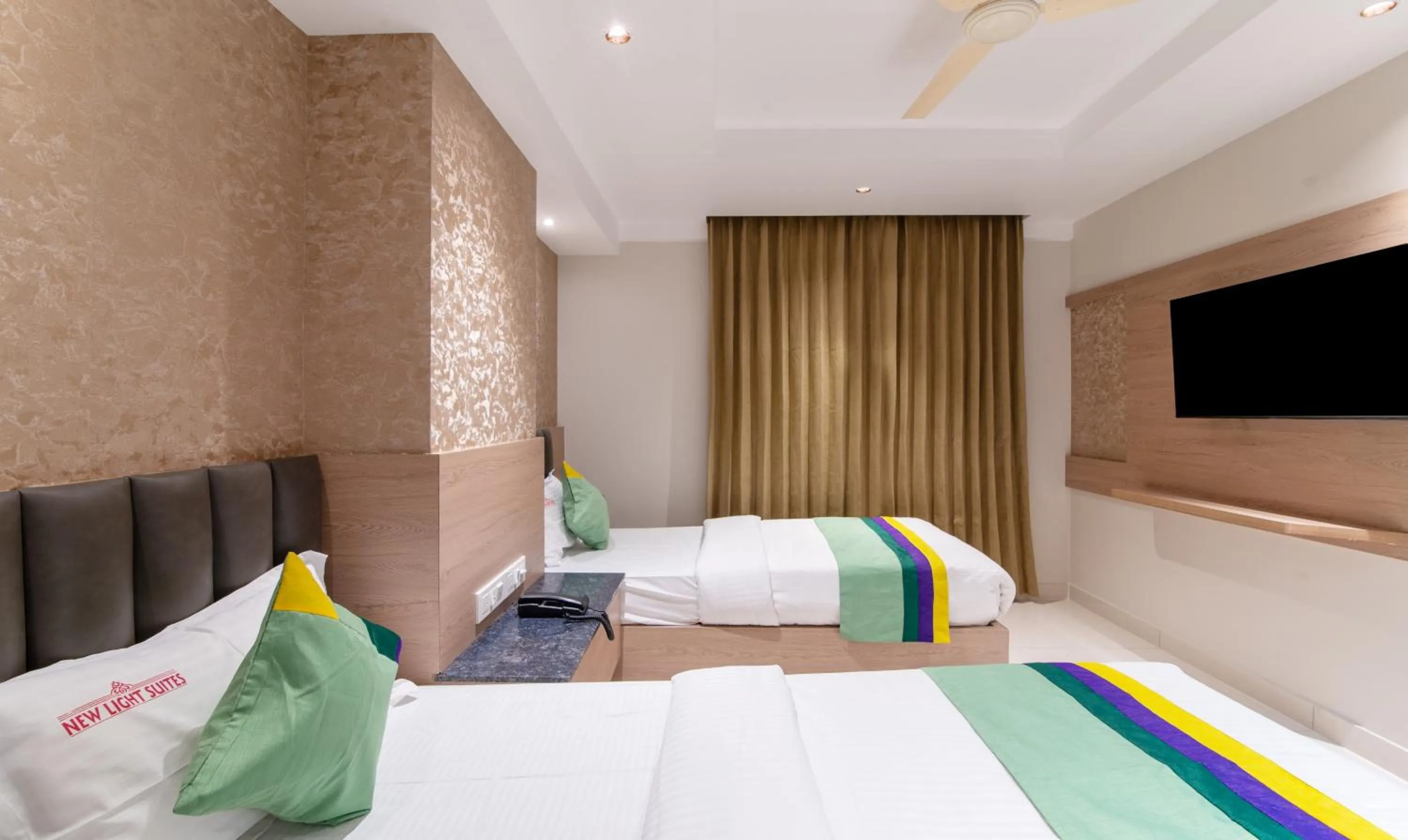 Bedroom, Bed in Treebo Premium New Light Suites