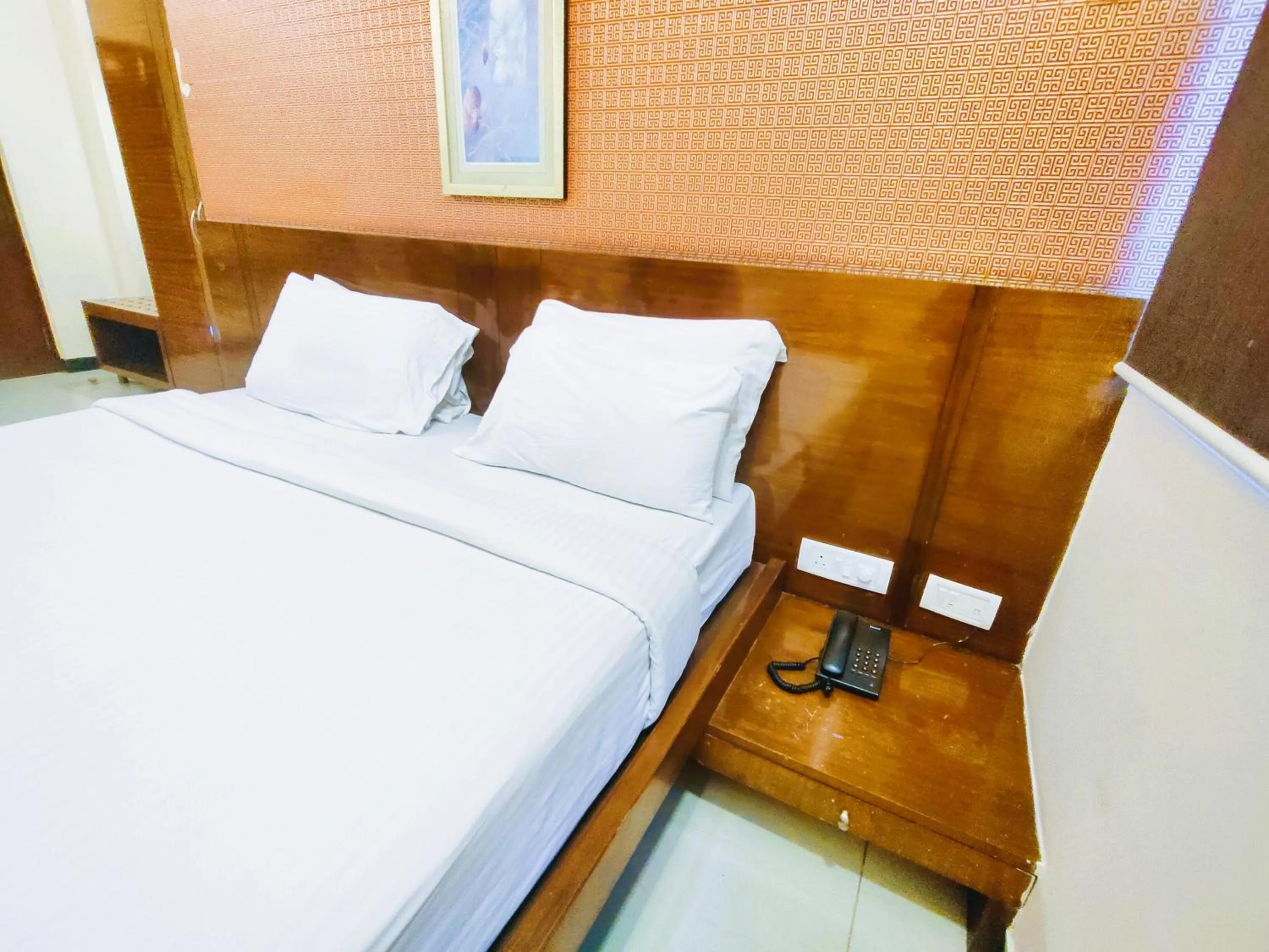 Bed in Athasri Hotel Infantry Road