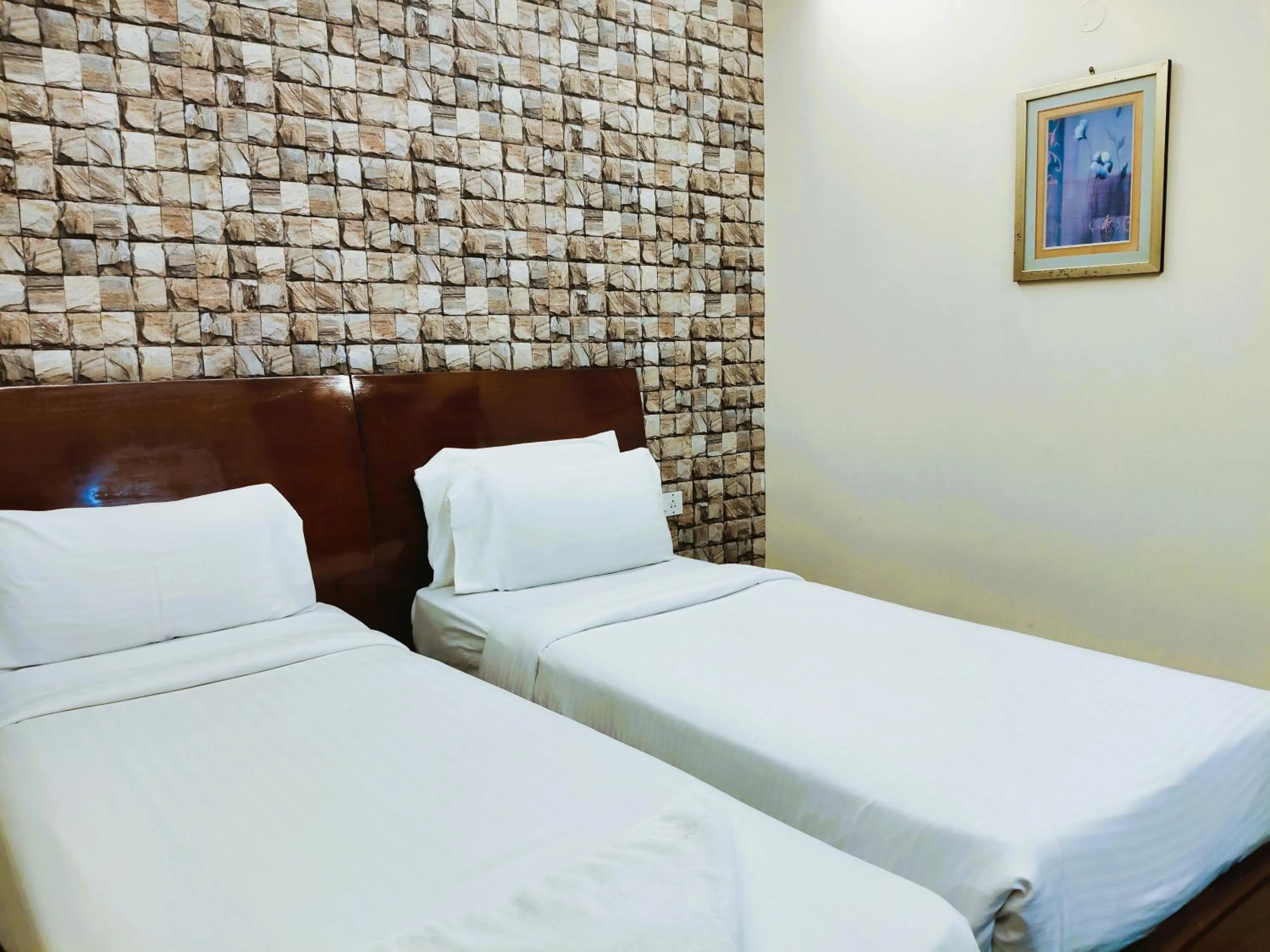 Bed in Athasri Hotel Infantry Road