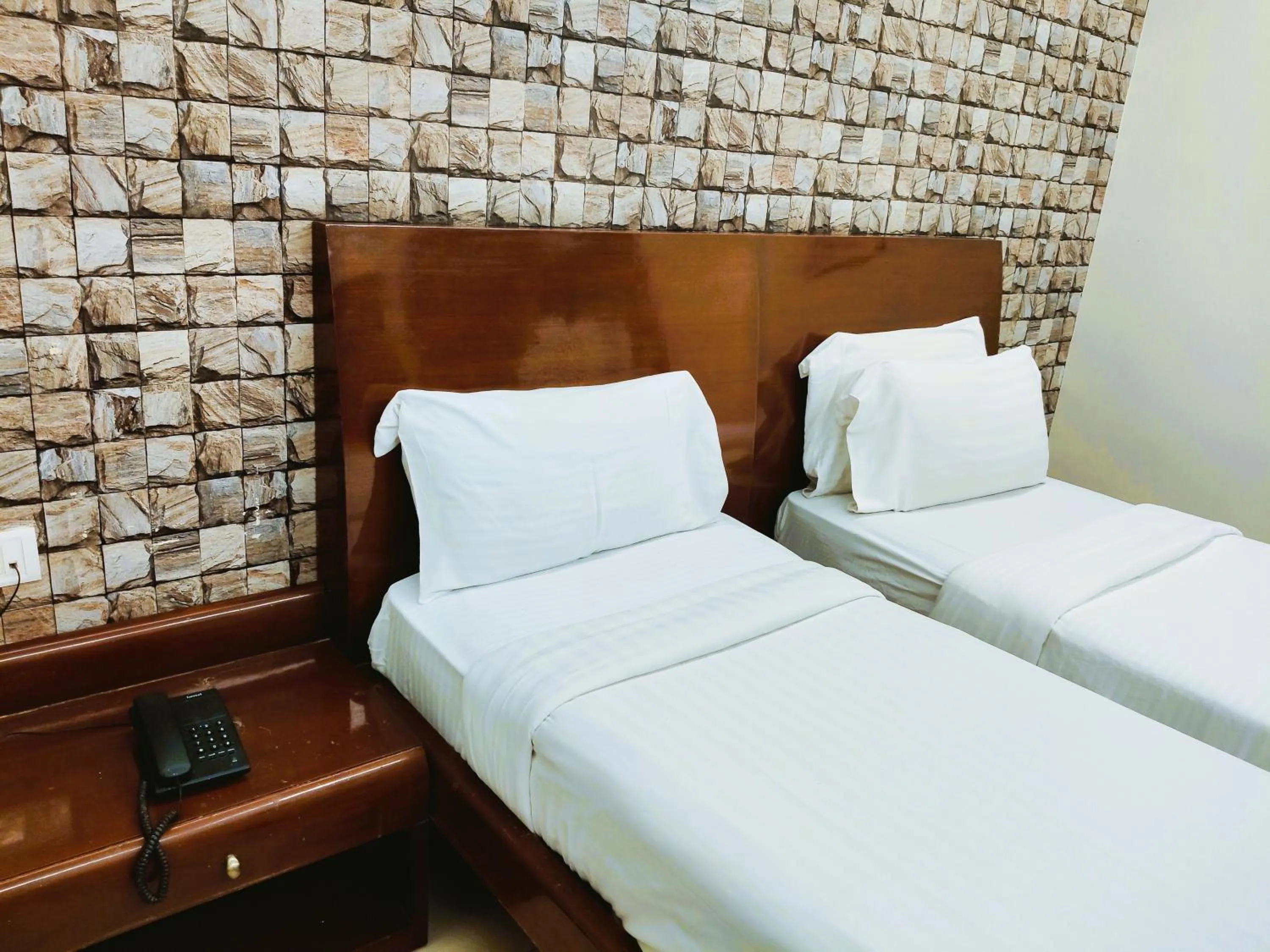 Bed in Athasri Hotel Infantry Road