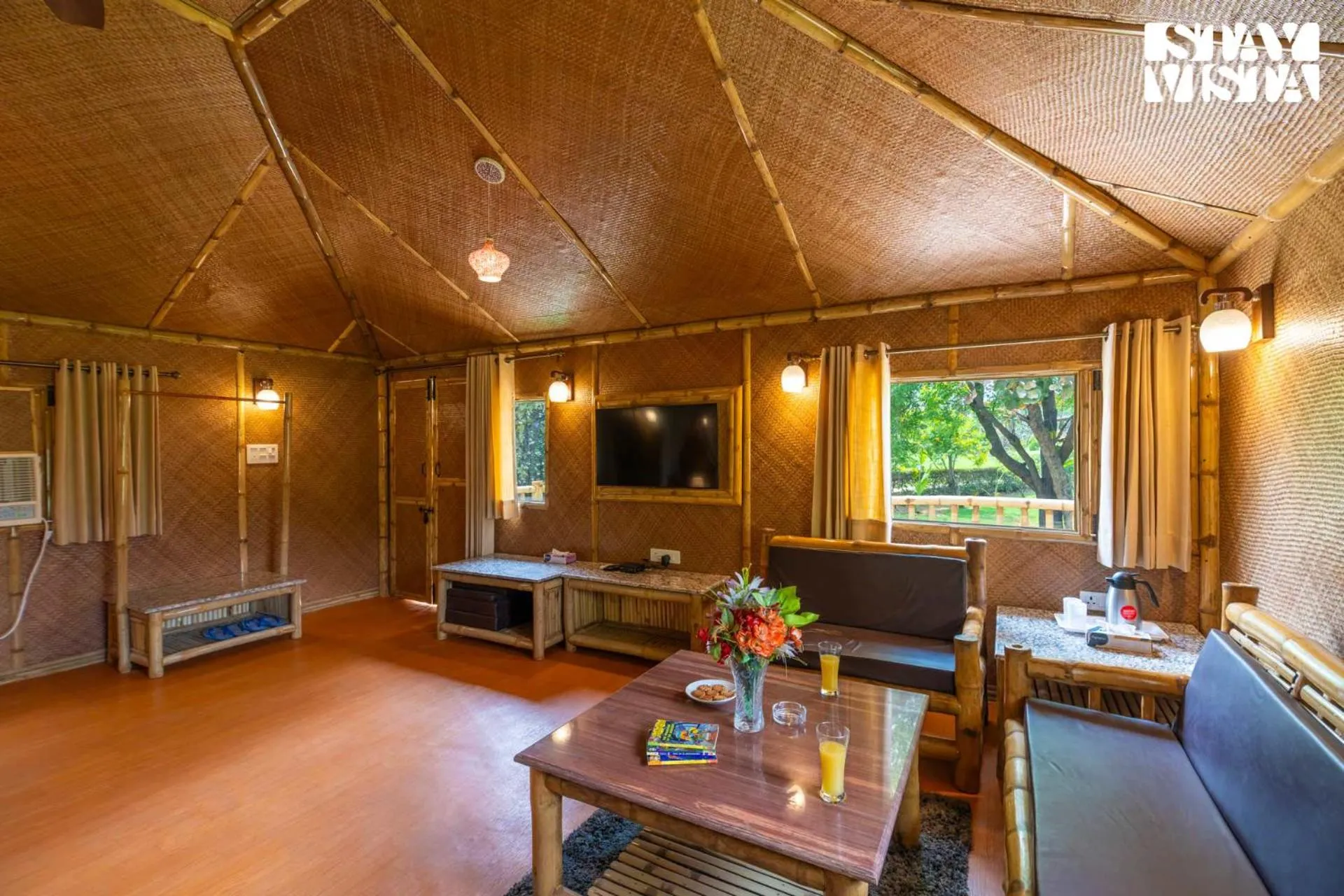 Living room in StayVista at Maple Farms with Pool, BBQ & Bonfire