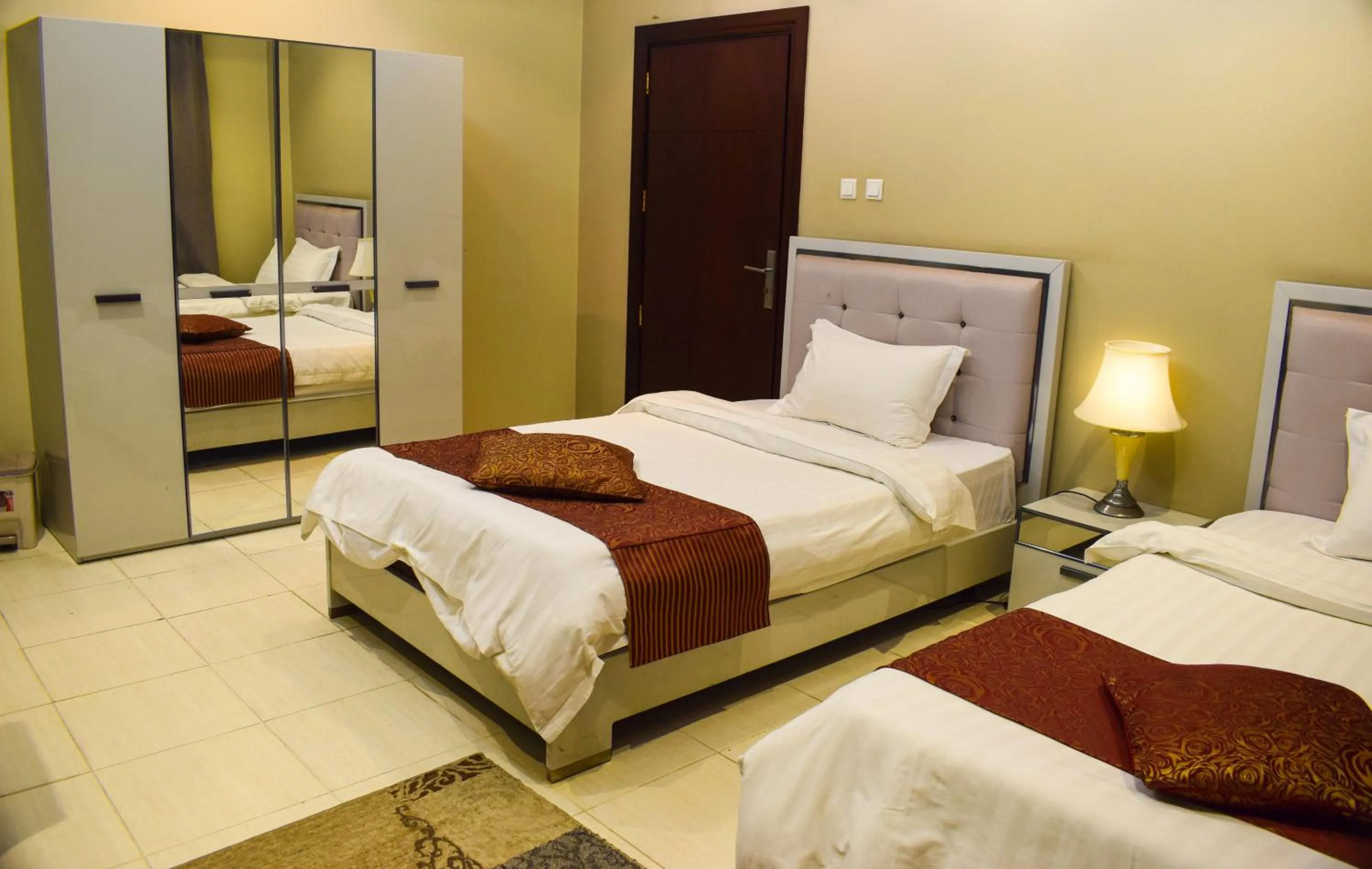 Bed in Arjan Qurtuba Served Apartments