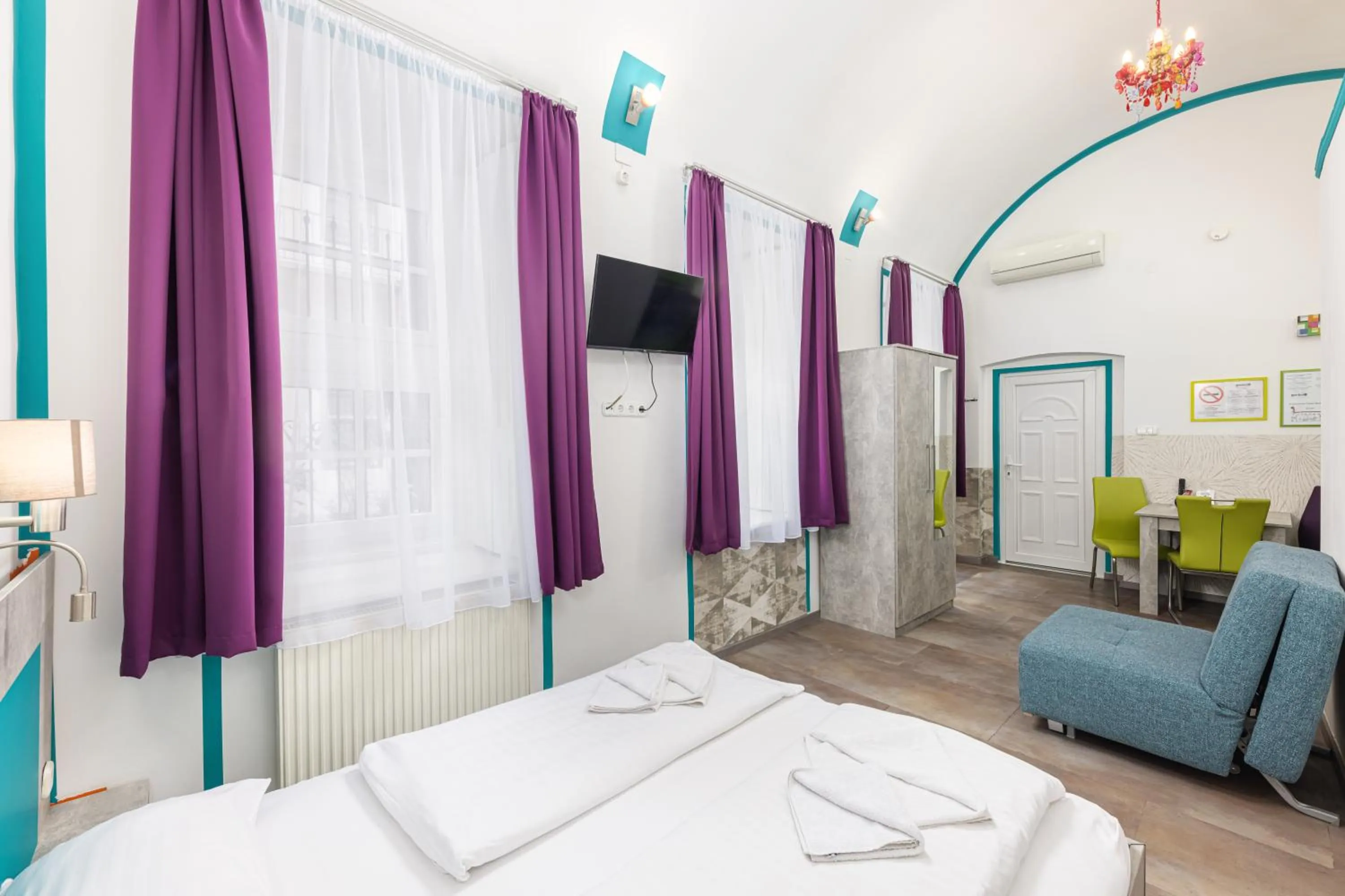 Bed in Amber Gardenview Studios Downtown