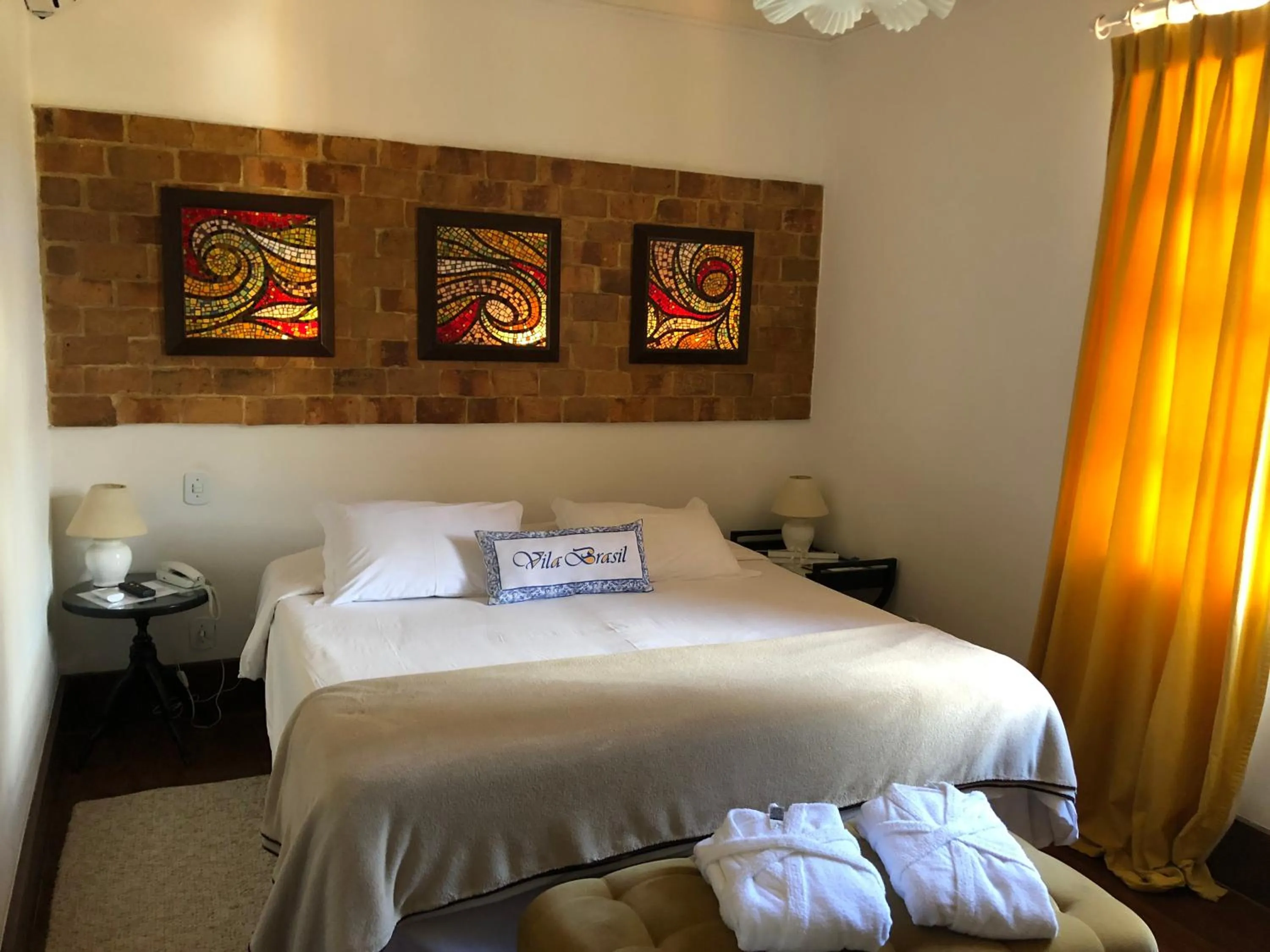 Bed in Pousada Vila Brasil