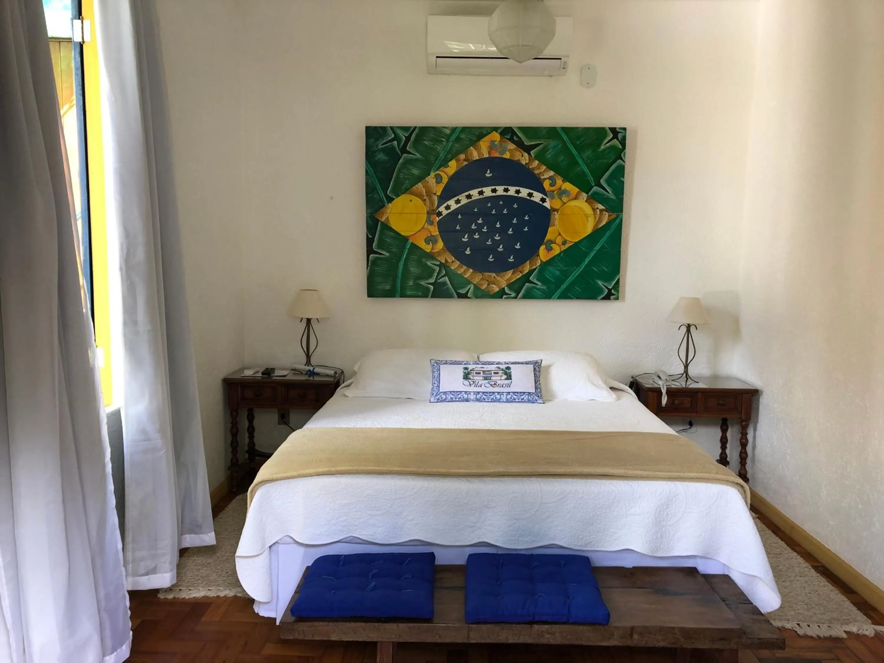 Bed in Pousada Vila Brasil