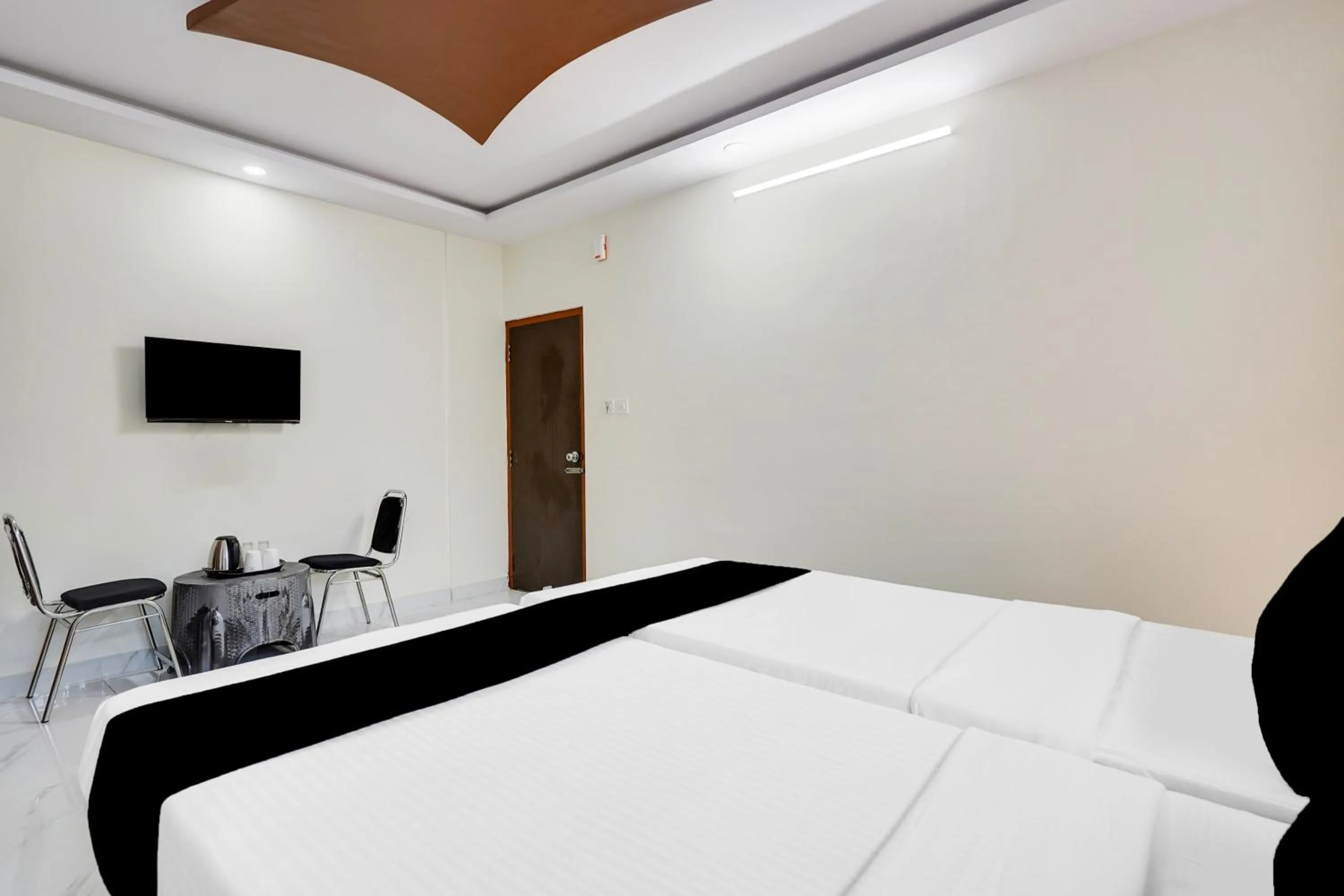 Bedroom in Super Townhouse Bidadi Formerly Royal Garuda