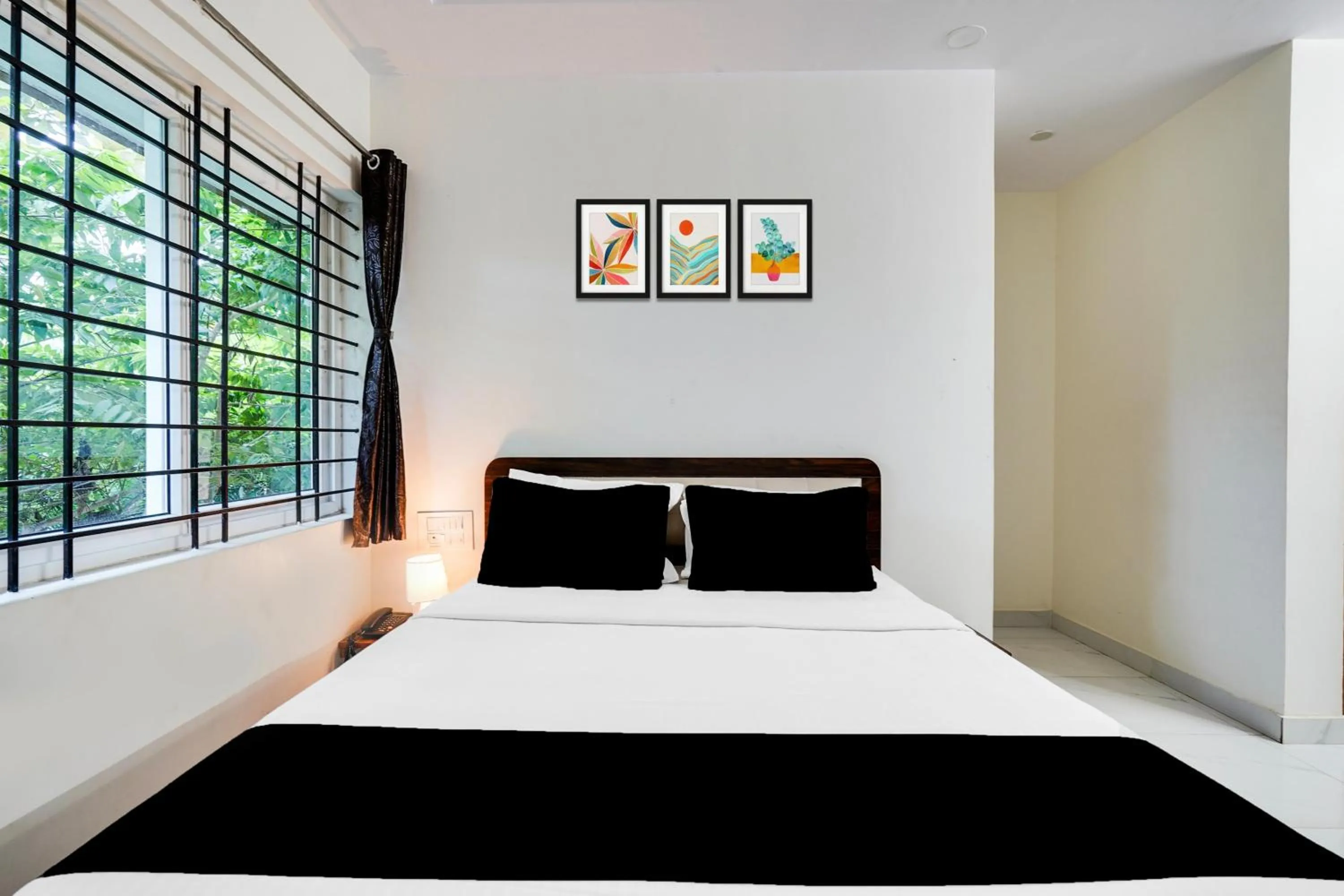 Bedroom in Super Townhouse Bidadi Formerly Royal Garuda