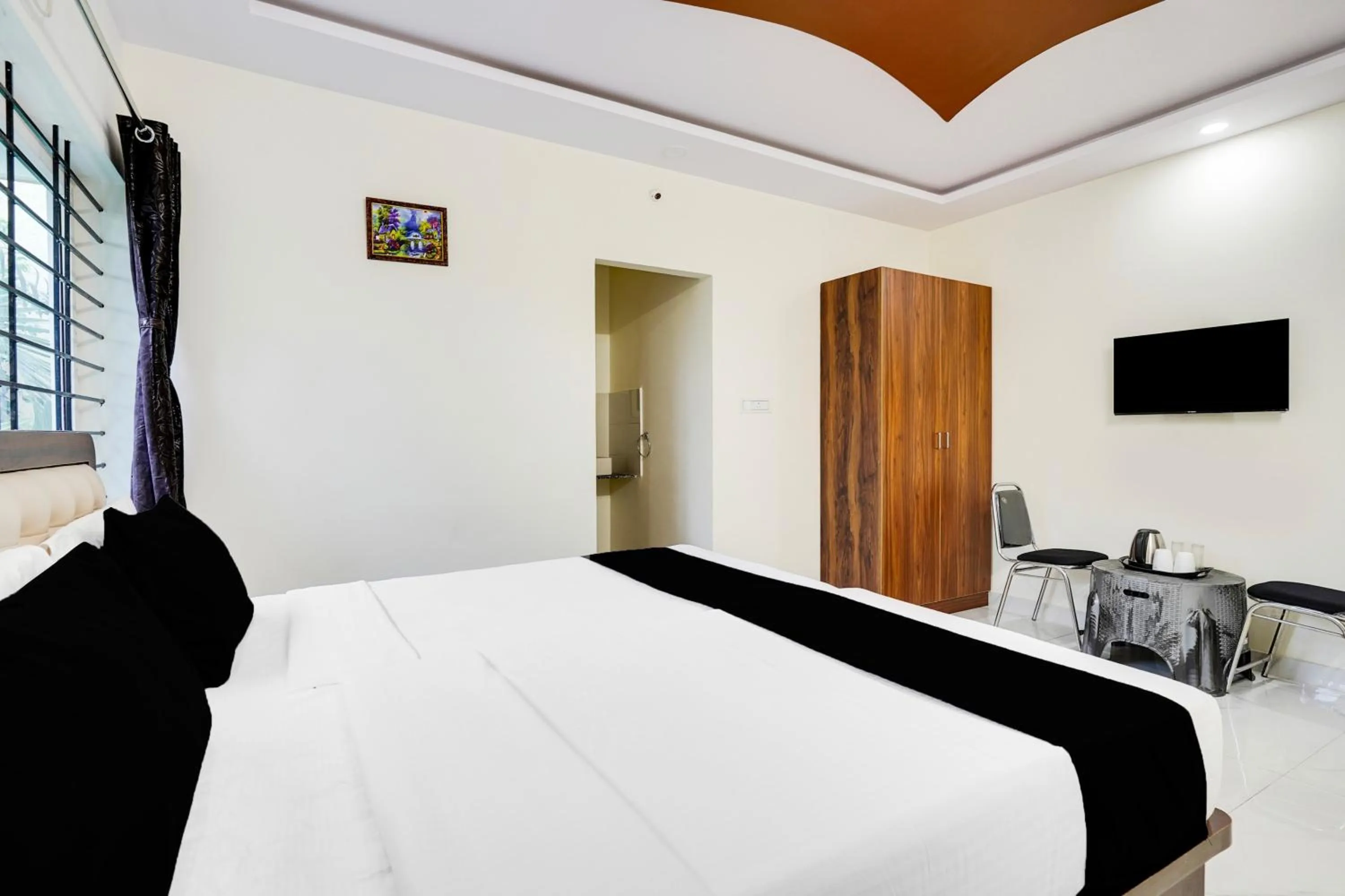 Bedroom in Super Townhouse Bidadi Formerly Royal Garuda