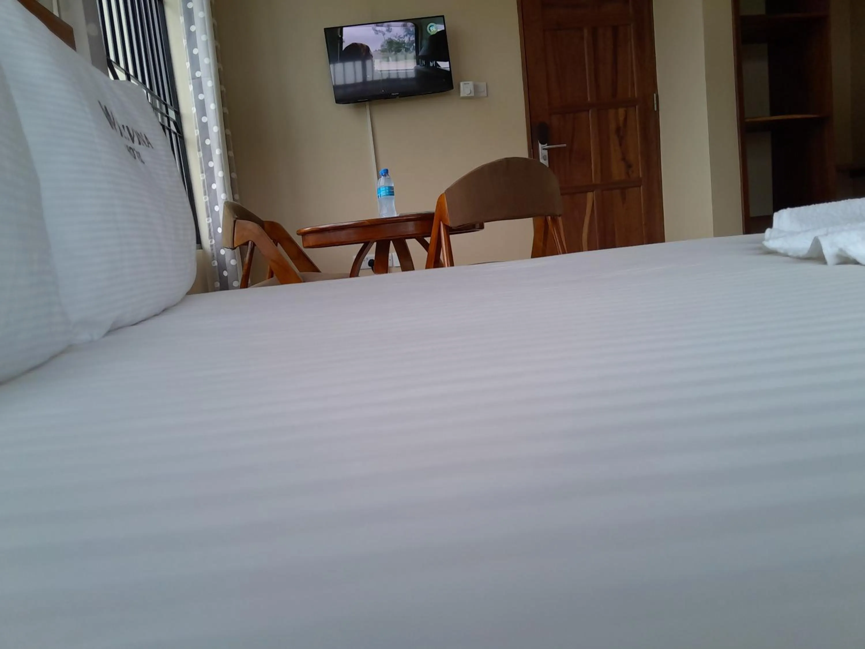 Bed in WILIVINA HOTEL