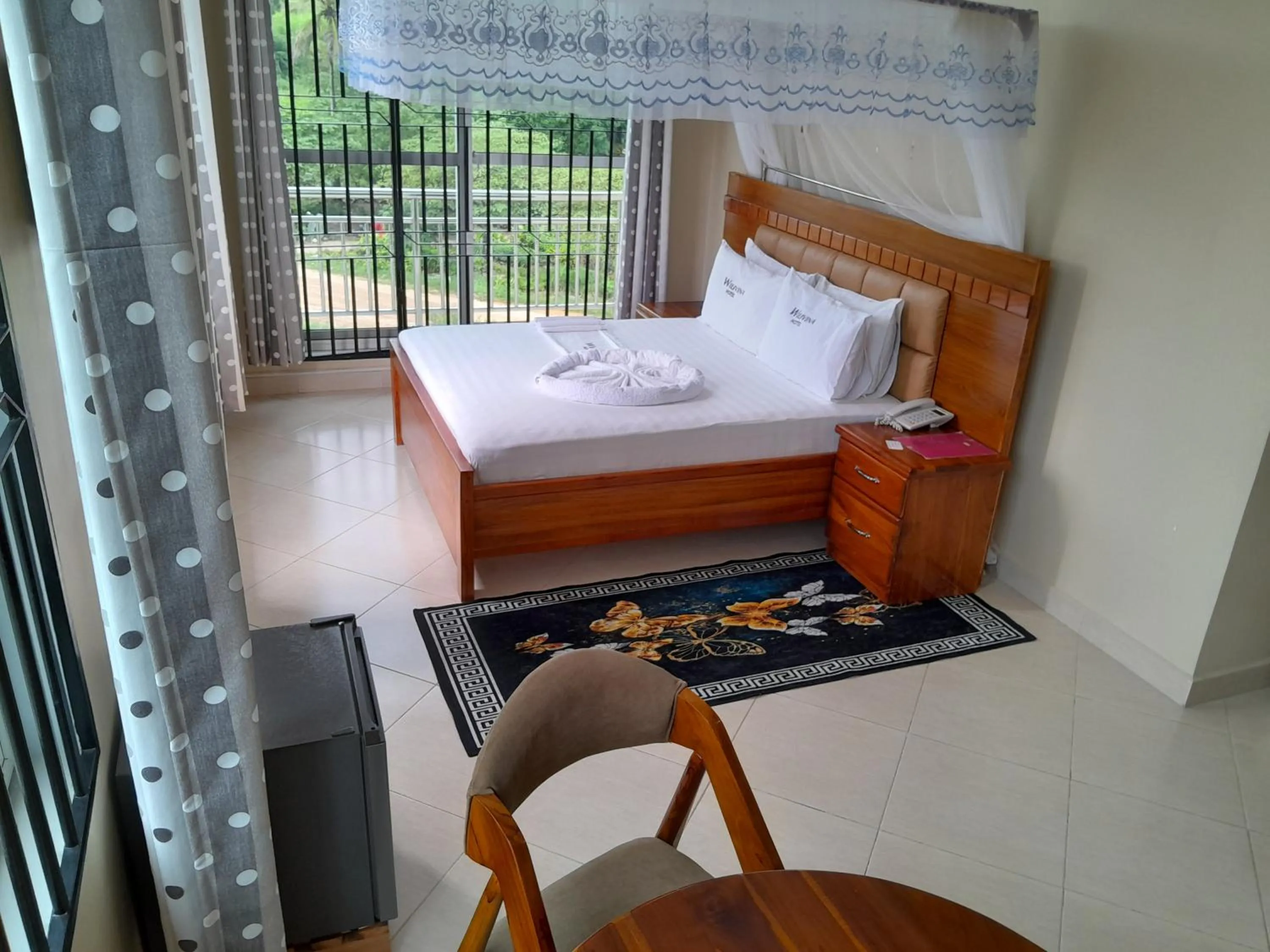 Bed in WILIVINA HOTEL