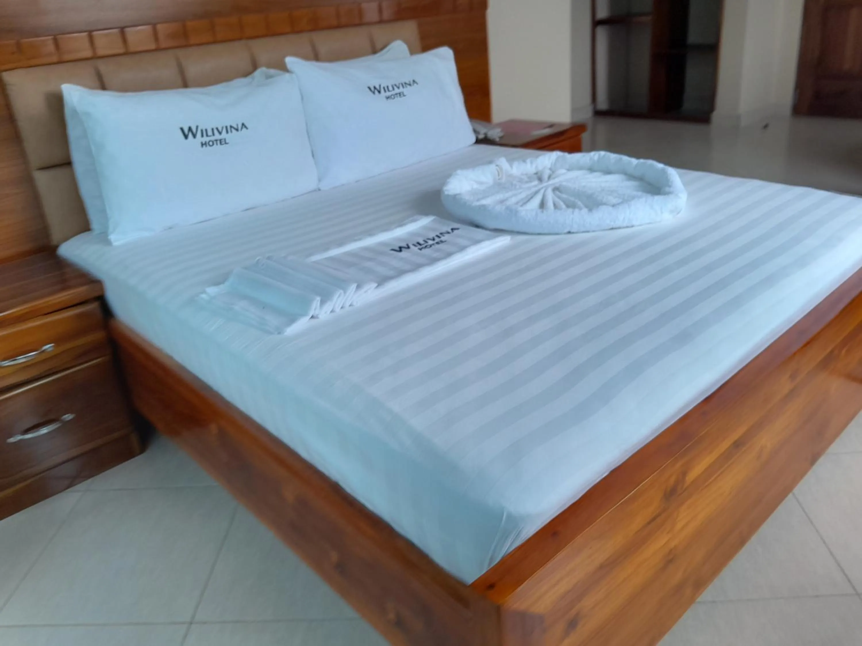 Bed in WILIVINA HOTEL