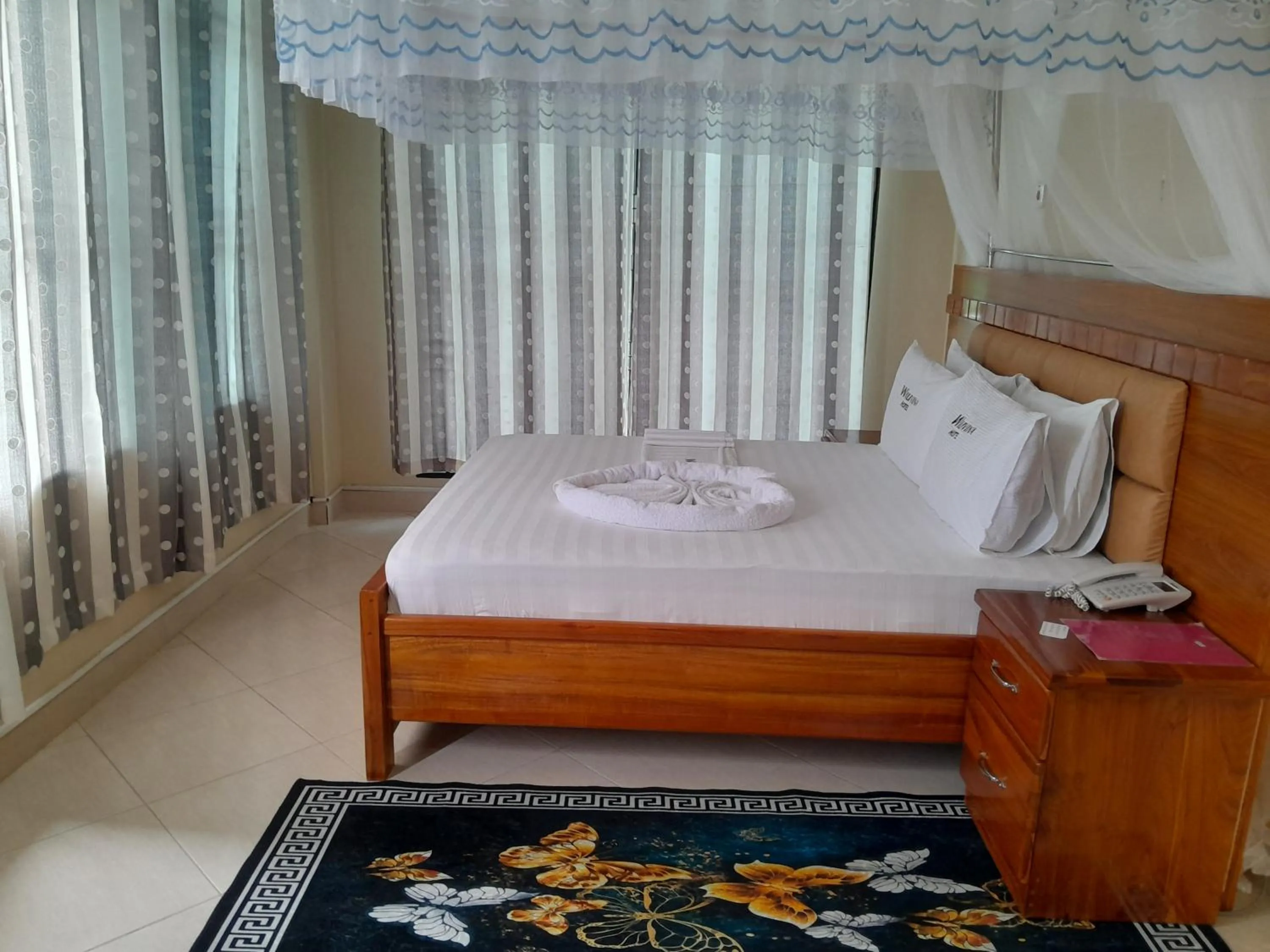 Bed in WILIVINA HOTEL