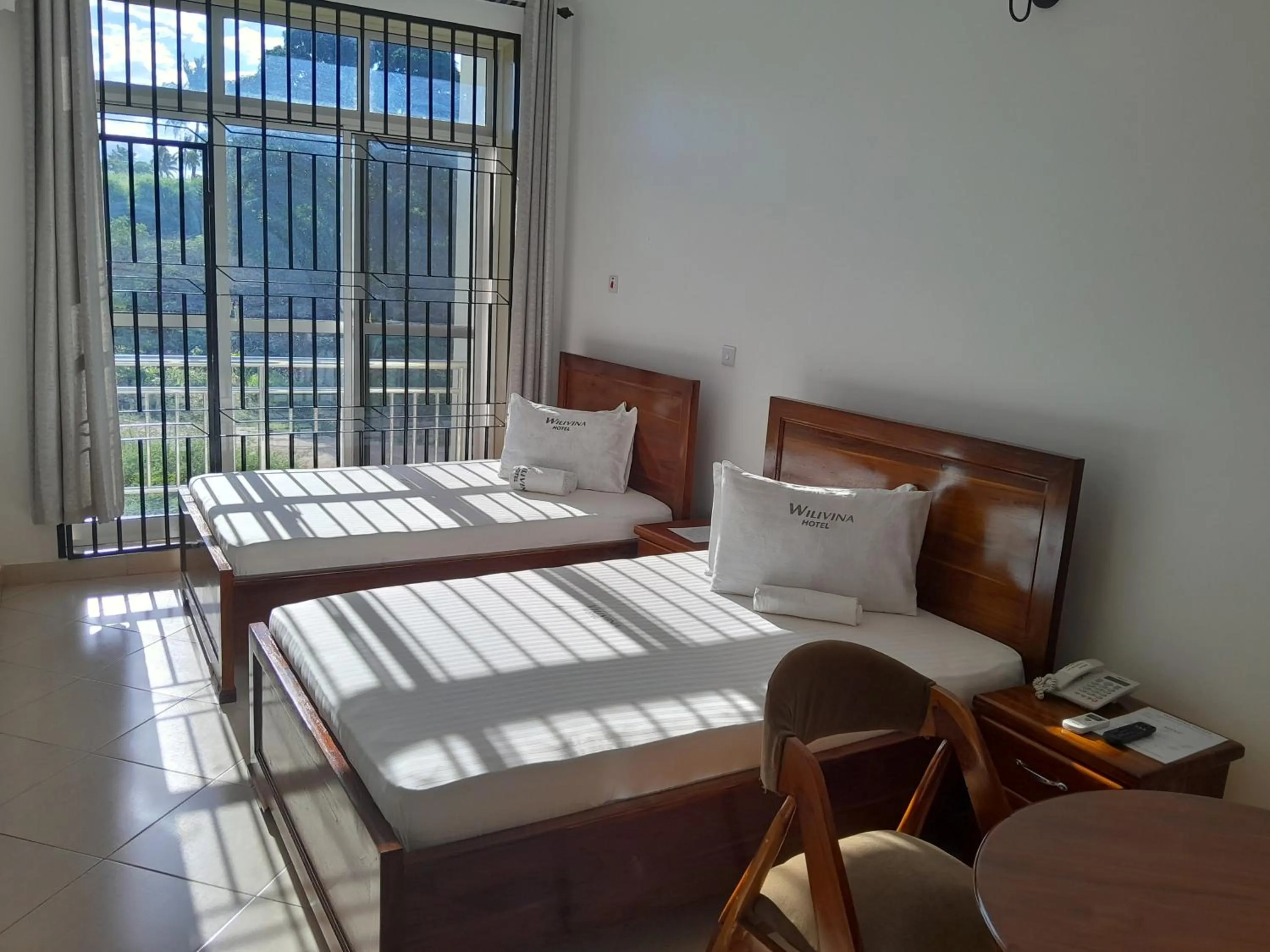 Bed in WILIVINA HOTEL