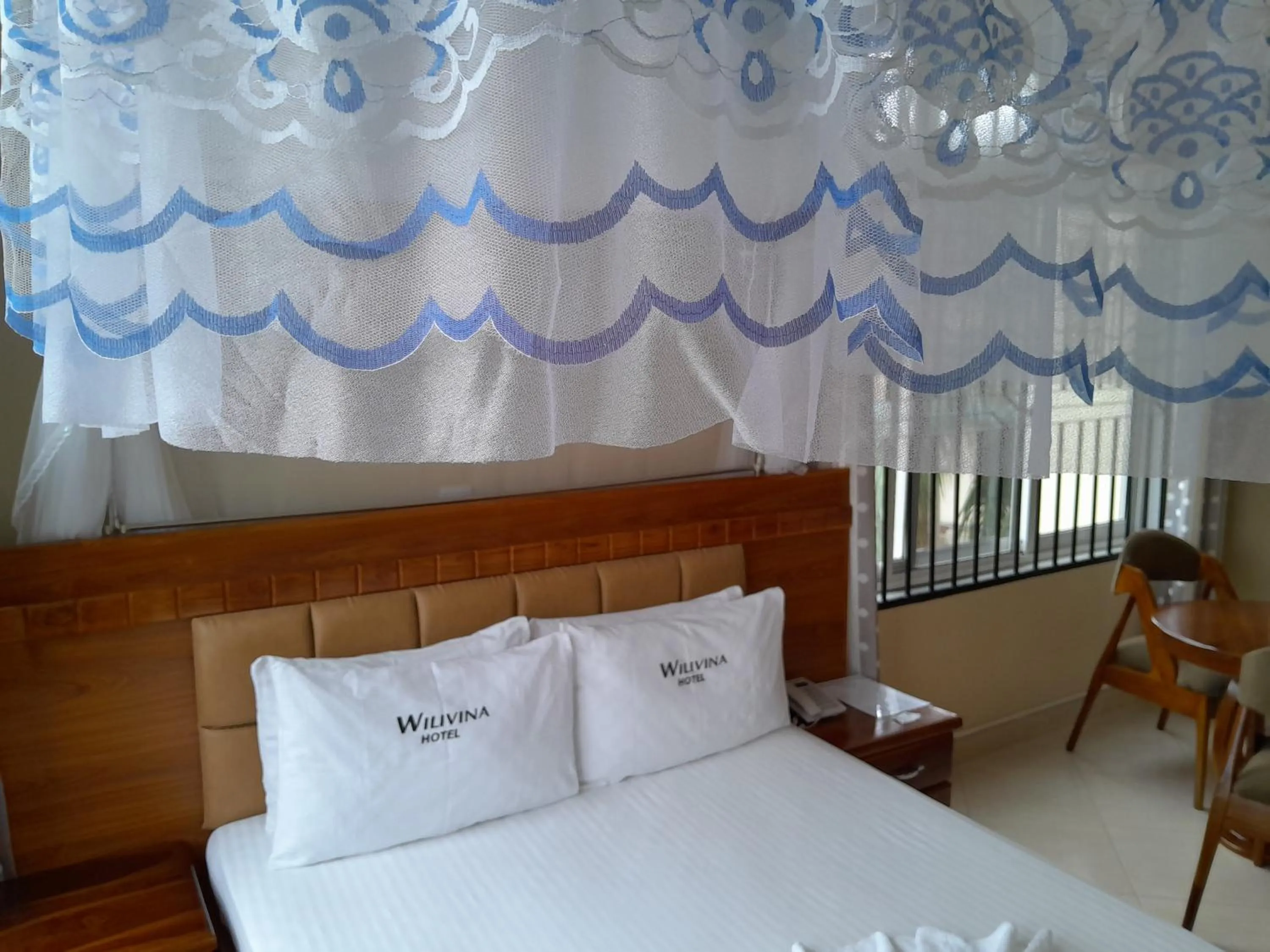 Bed in WILIVINA HOTEL