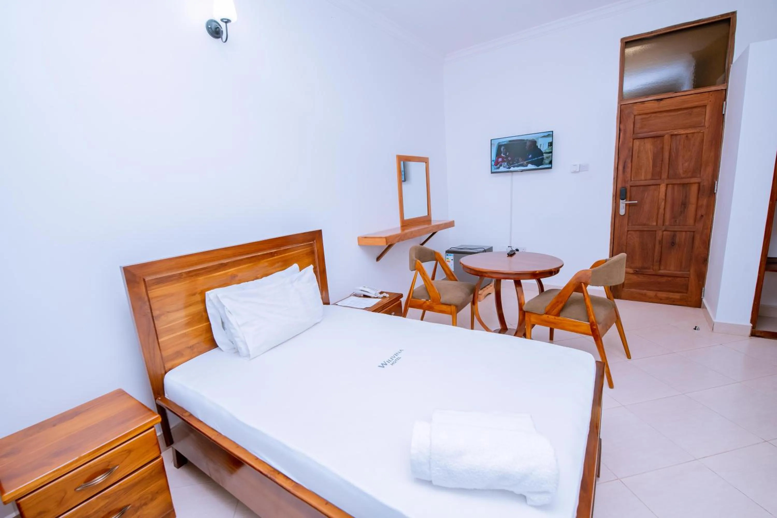 Bed in WILIVINA HOTEL