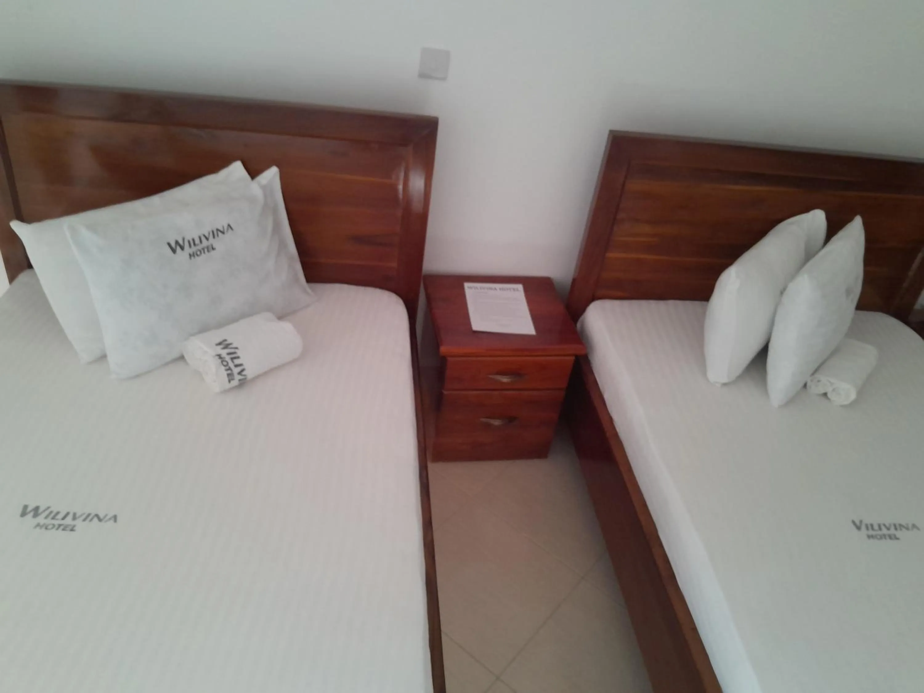 Bed in WILIVINA HOTEL