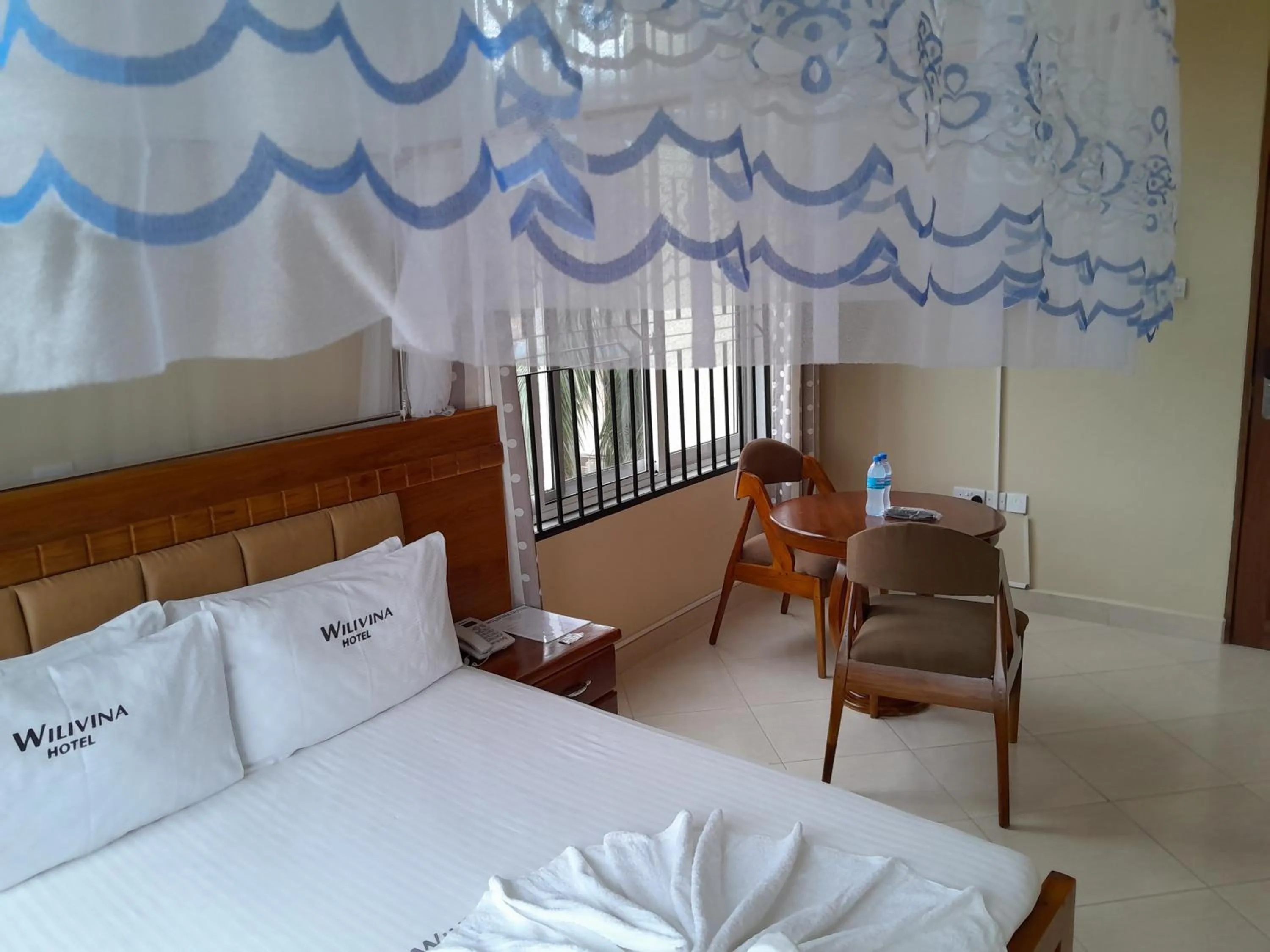 Bed in WILIVINA HOTEL