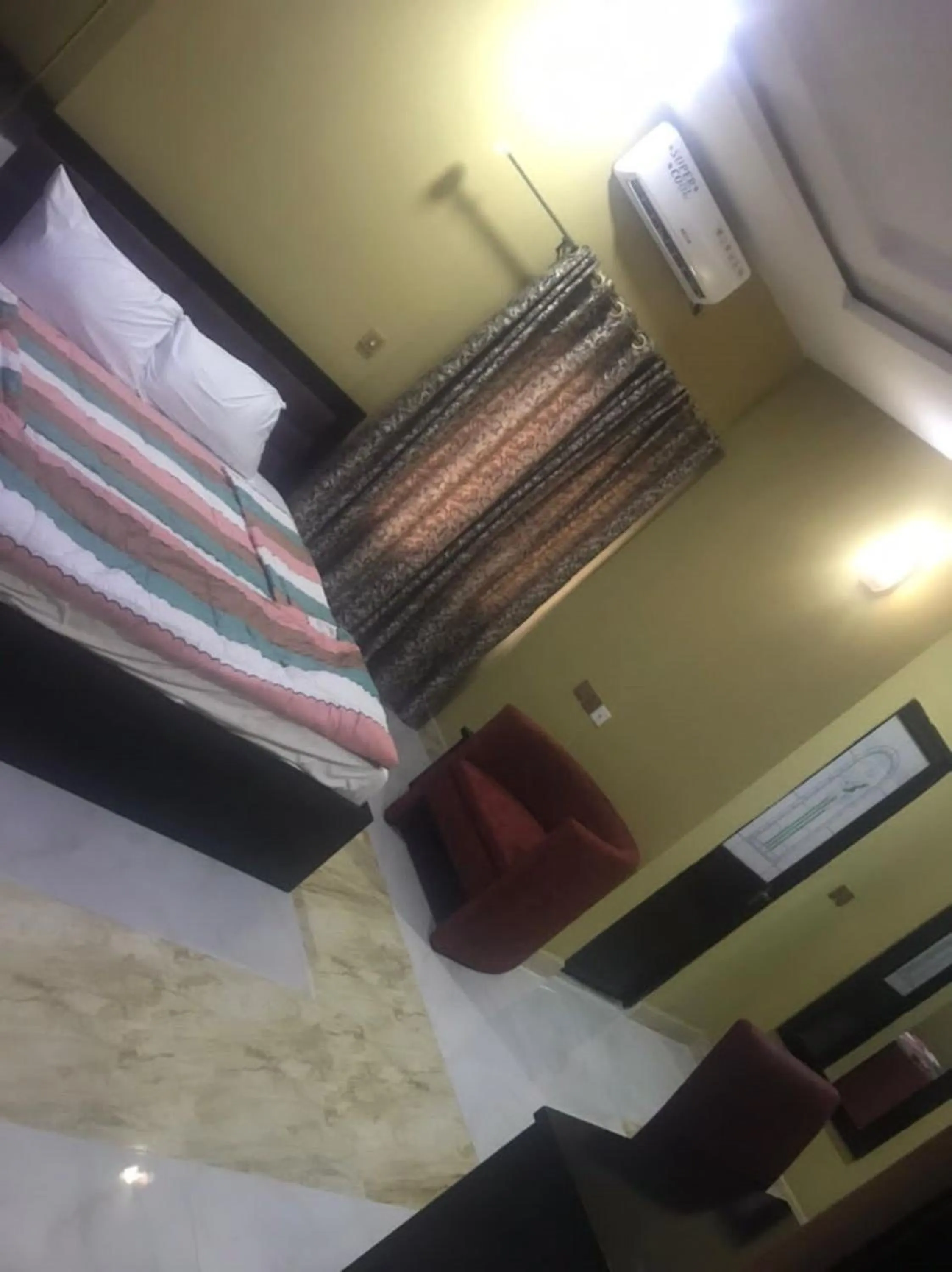 Bed in STARSAPPHIRE LUXURY HOTELS LTD