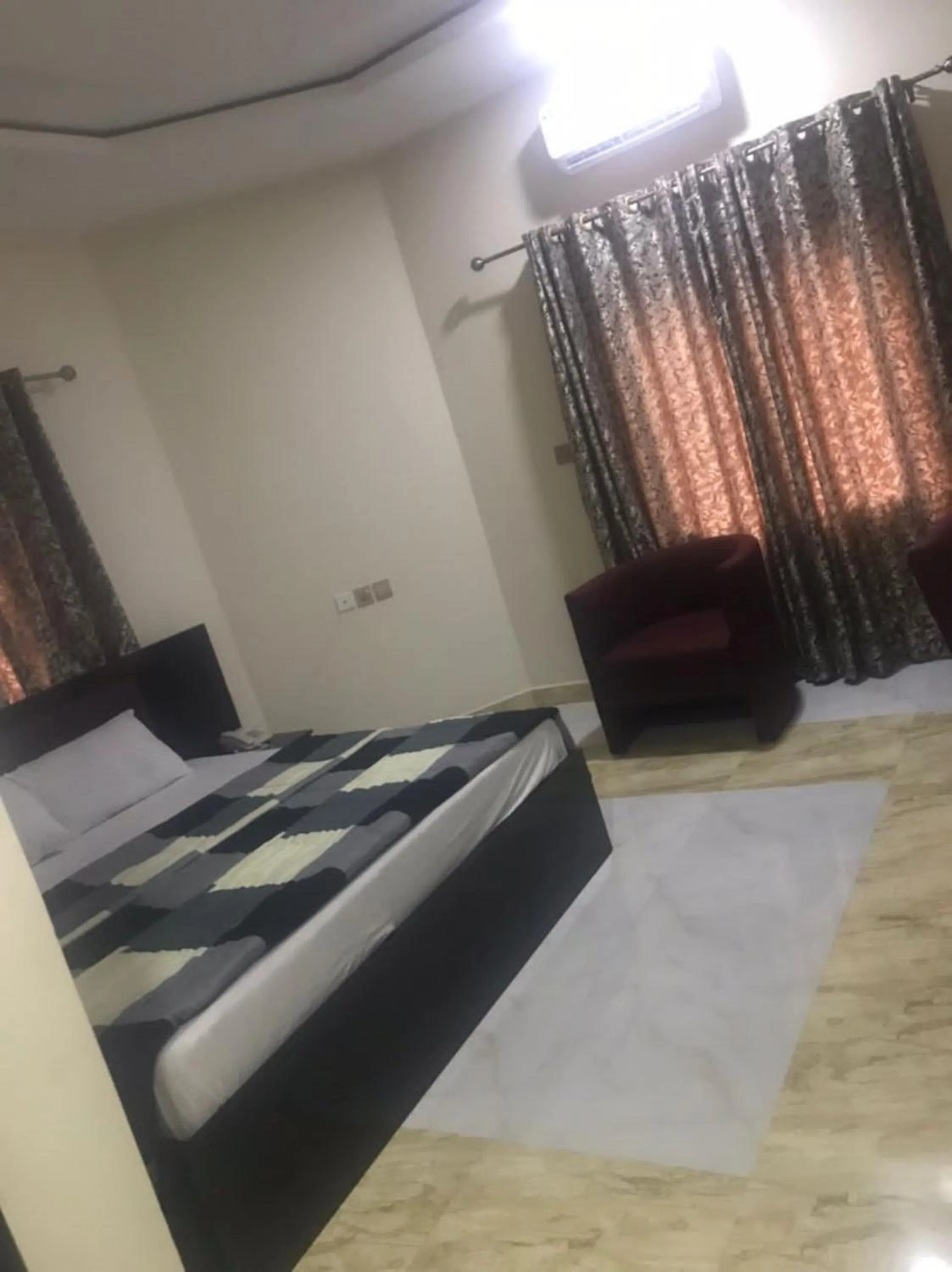 Bed in STARSAPPHIRE LUXURY HOTELS LTD