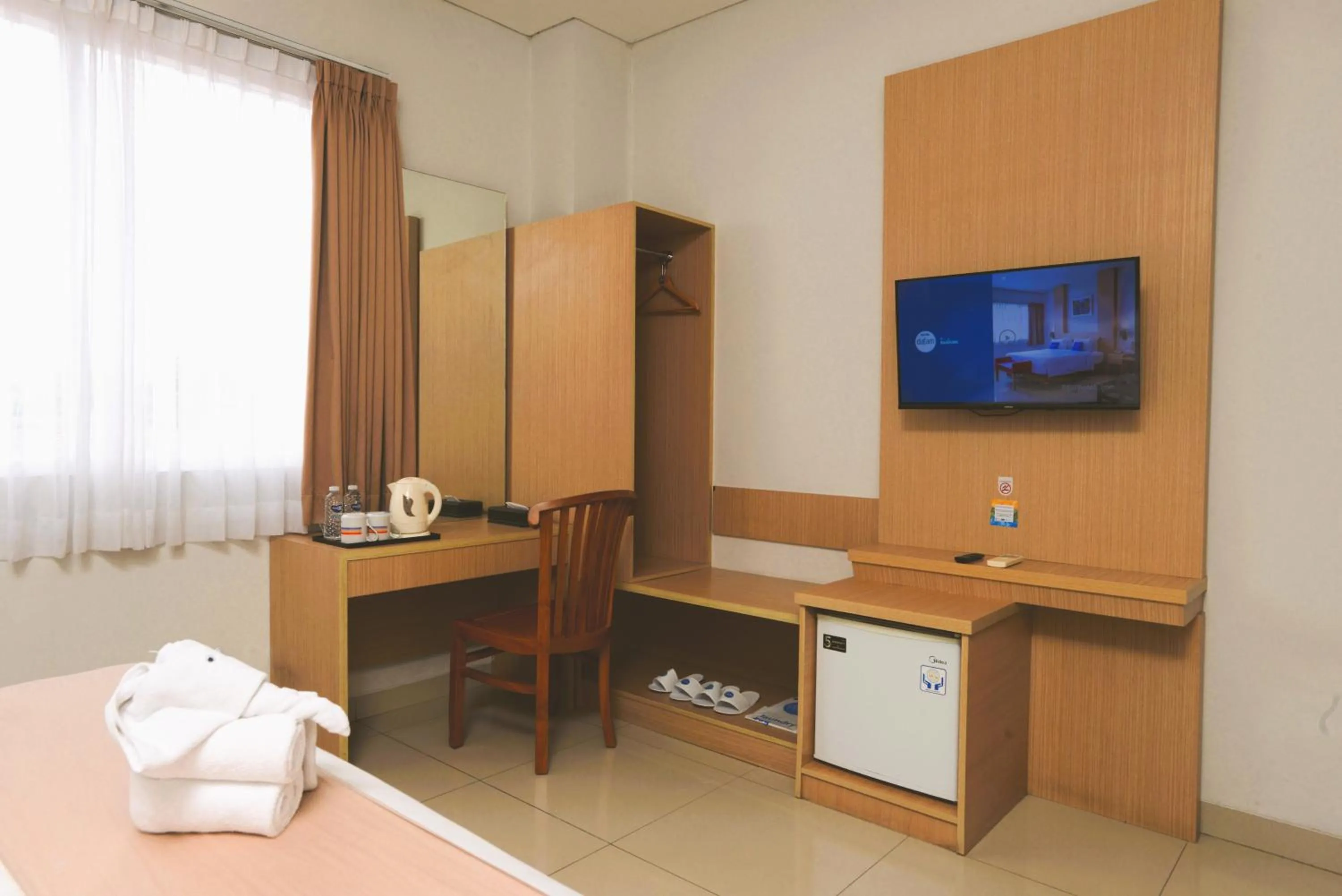 Bed in Hotel Dafam Rio