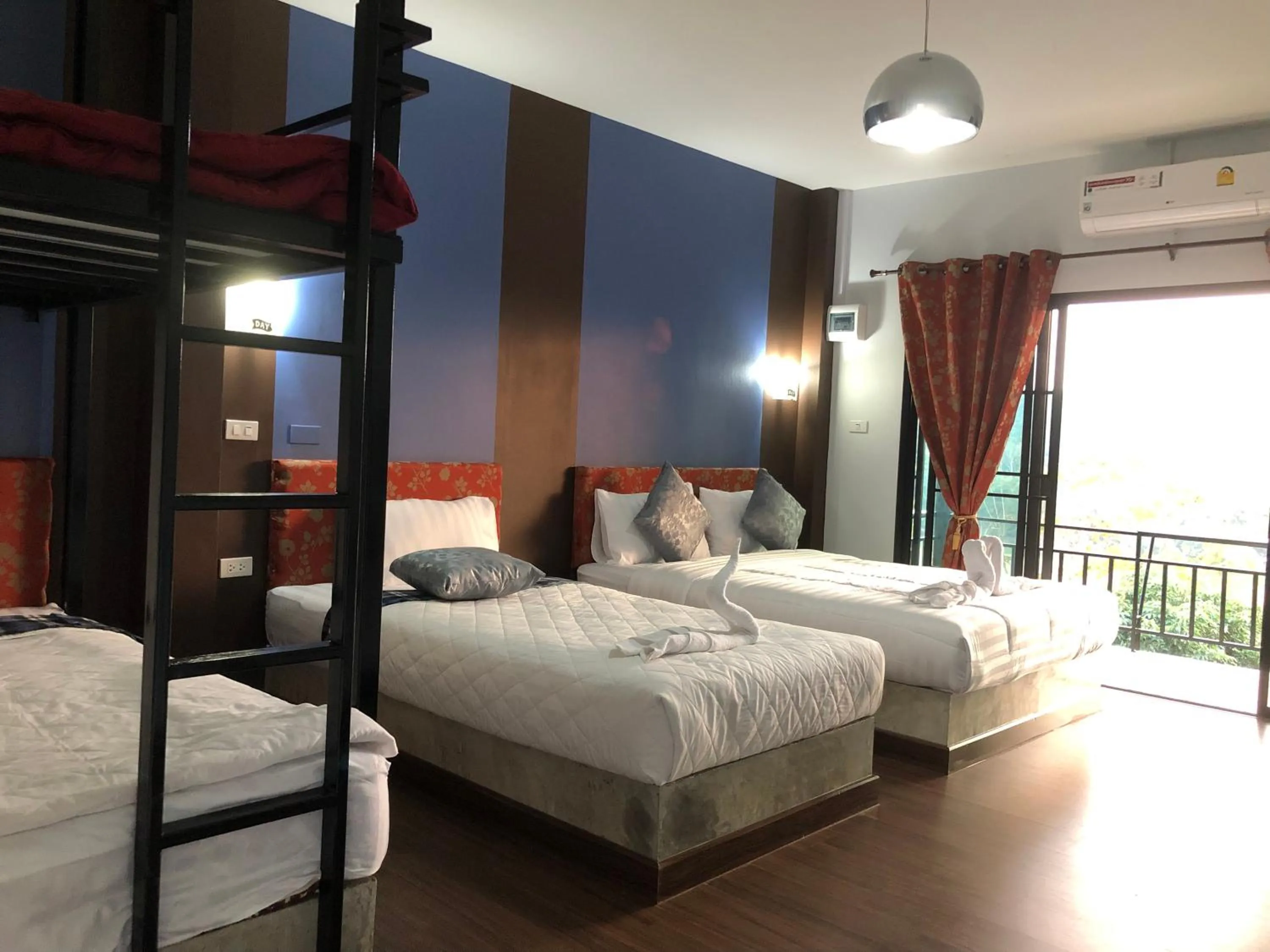 Bed in Baan Rai Phufah Resort Chiangrai