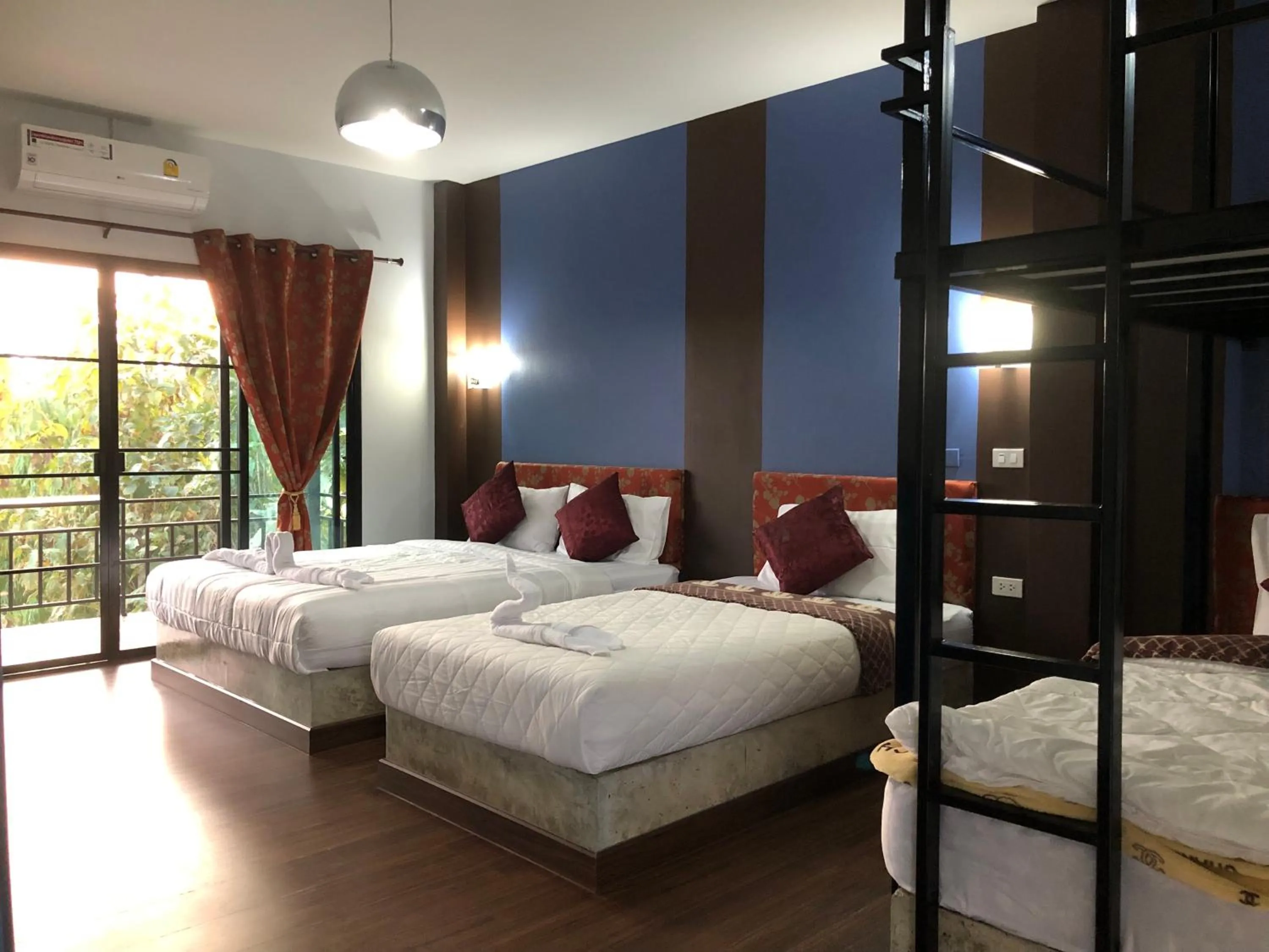 Bed in Baan Rai Phufah Resort Chiangrai