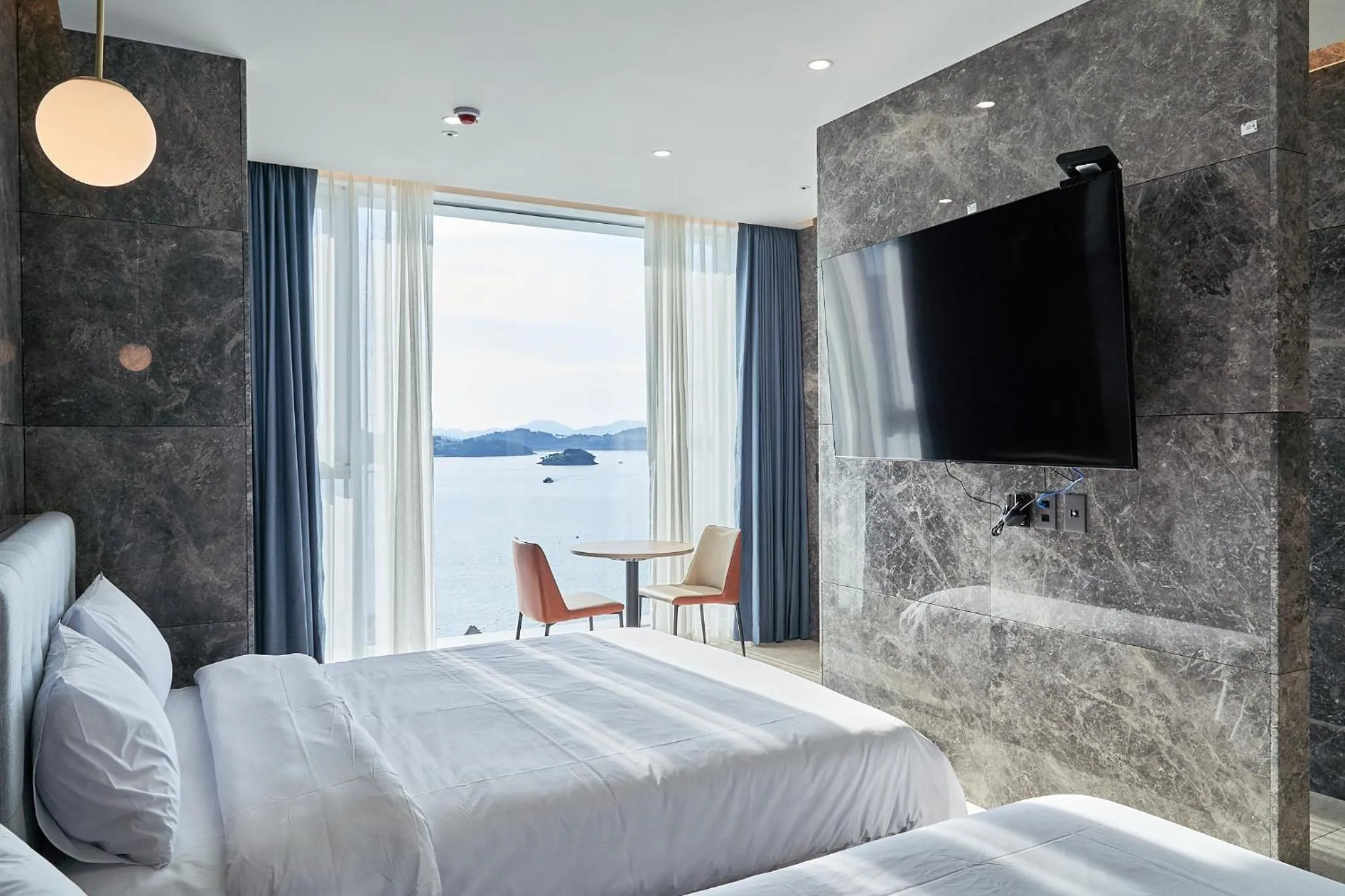 Photo of the whole room, Bed in Yeosu Calacatta Hotel & Resort