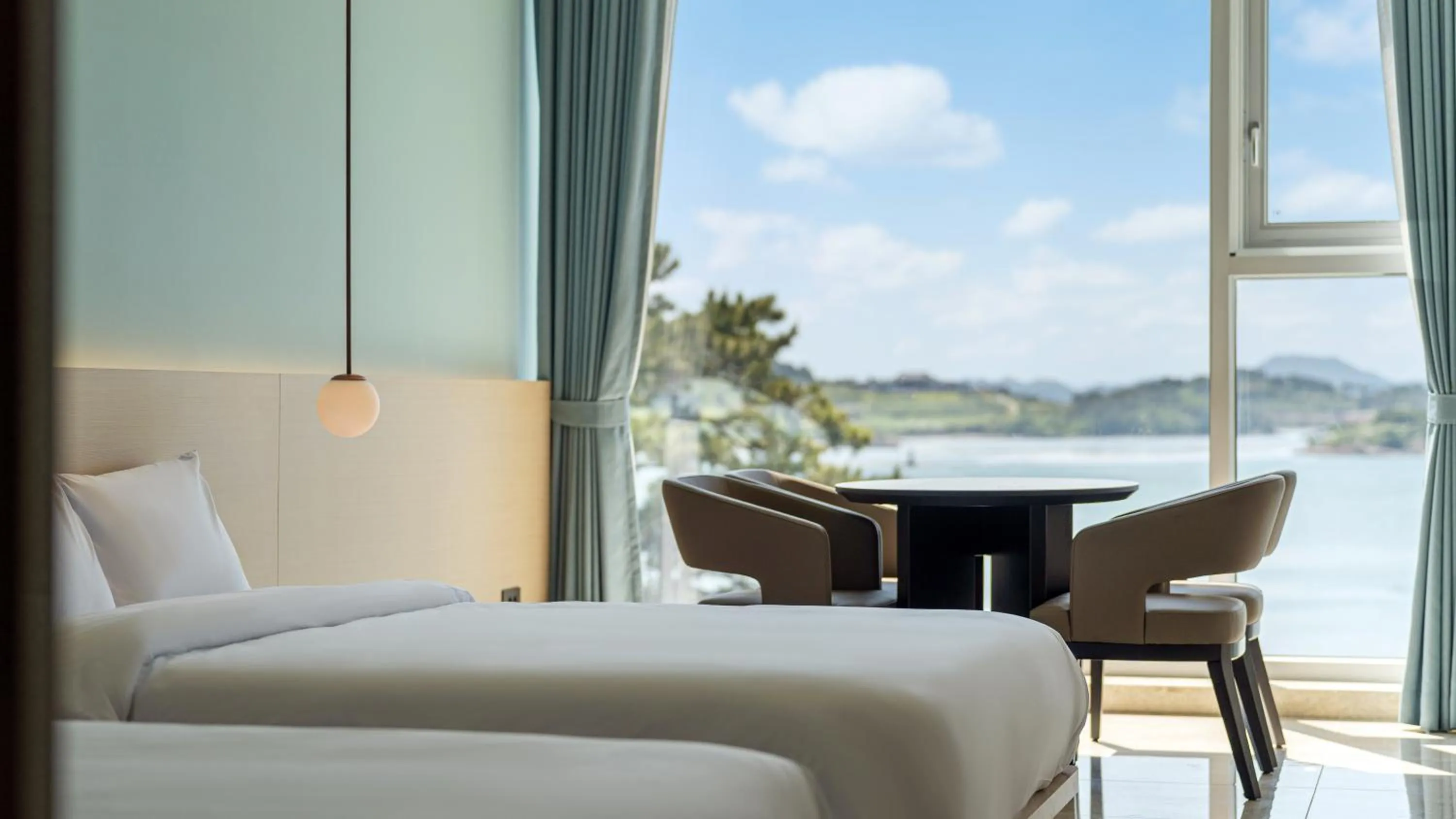 Photo of the whole room, Bed in Yeosu Calacatta Hotel & Resort