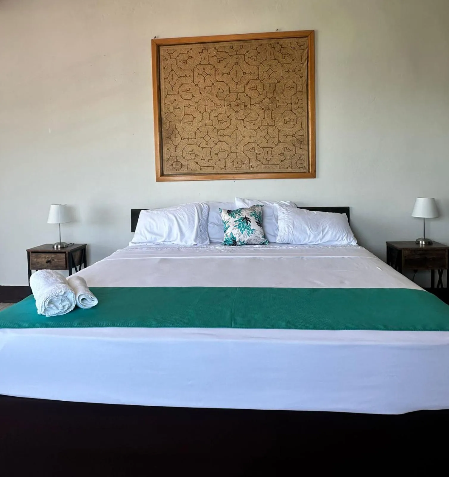 Bed in La Posada del Cauchero Hotel & Suites