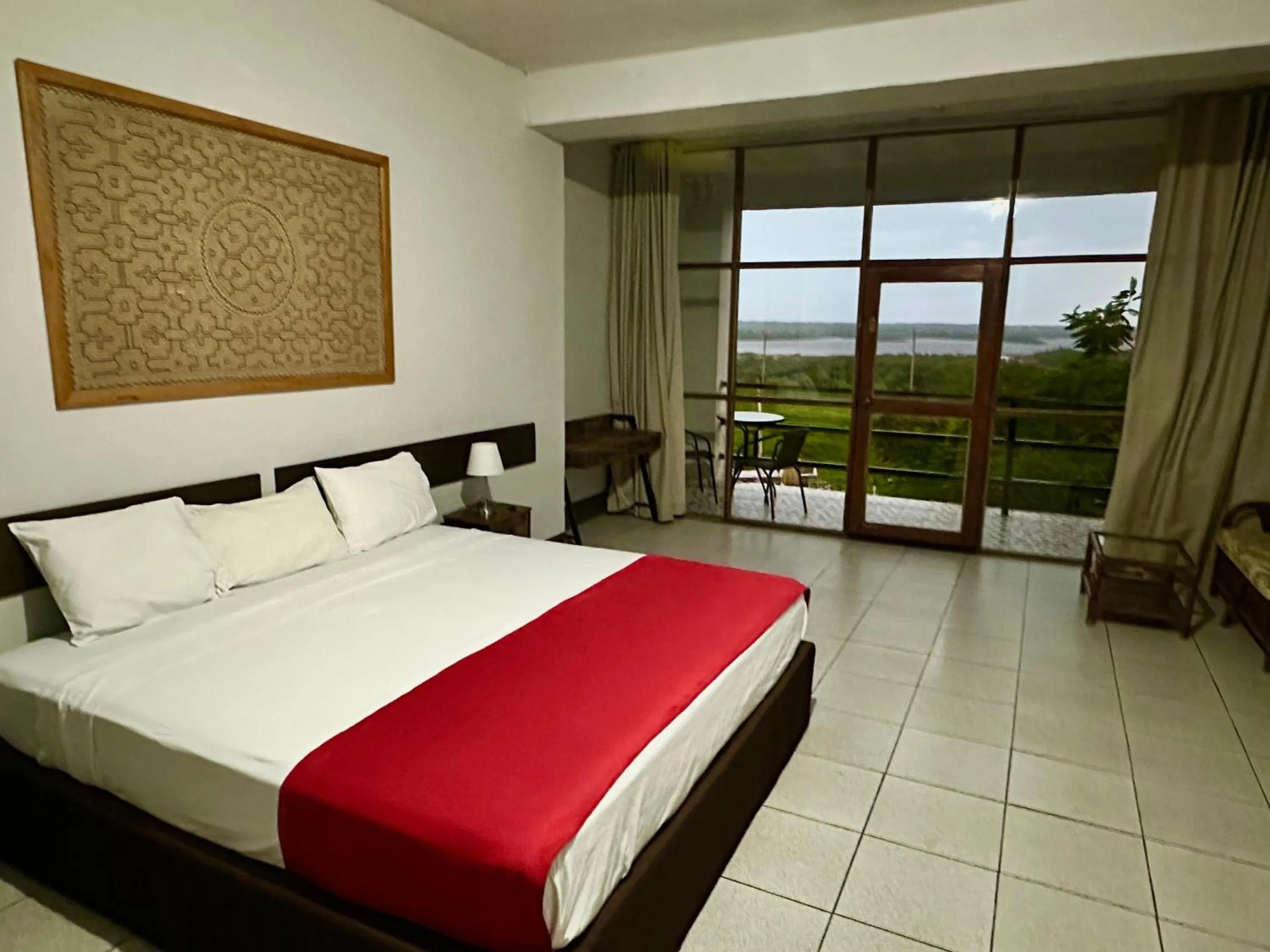 Bed in La Posada del Cauchero Hotel & Suites