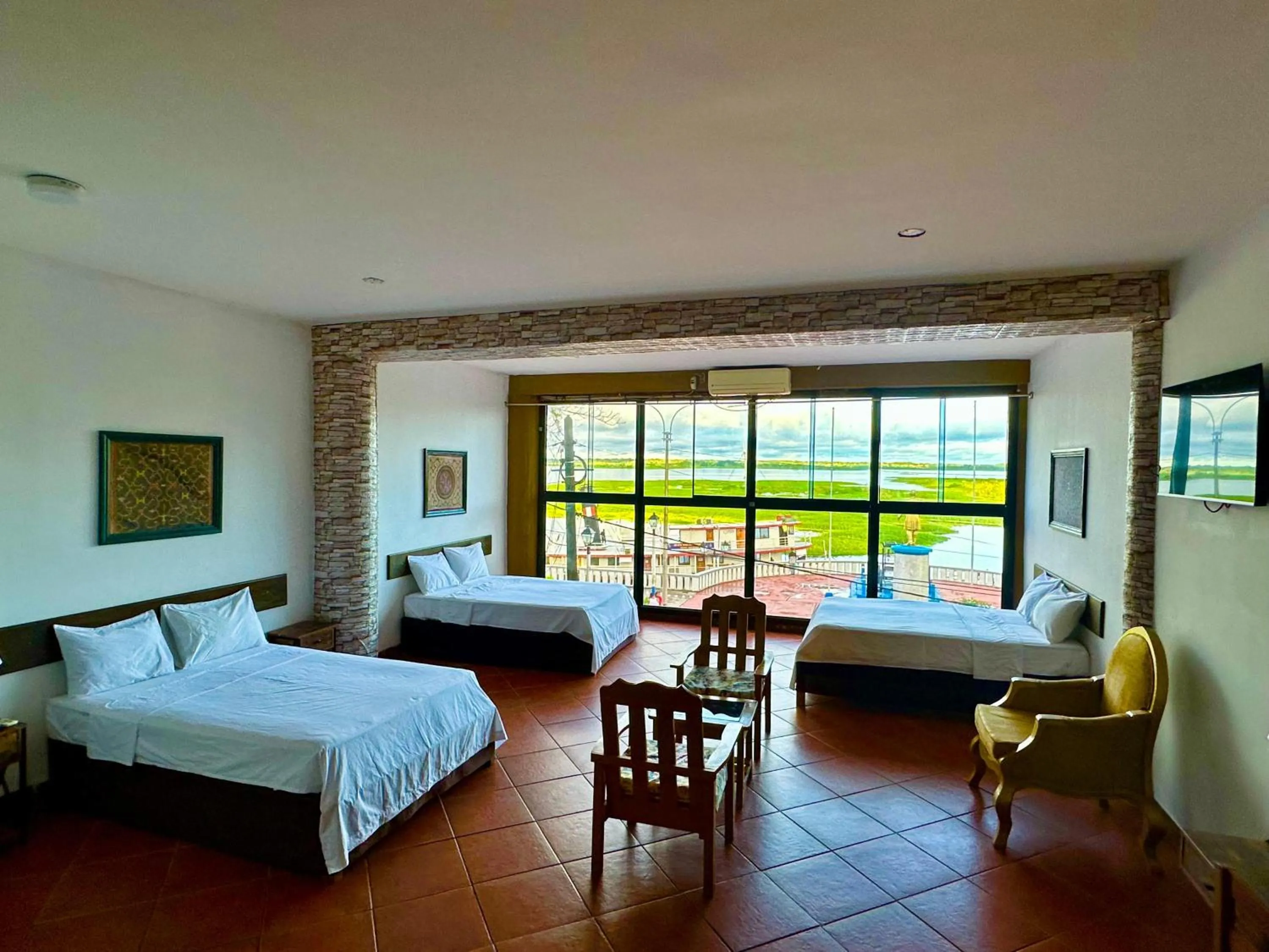 Photo of the whole room, Bed in La Posada del Cauchero Hotel & Suites