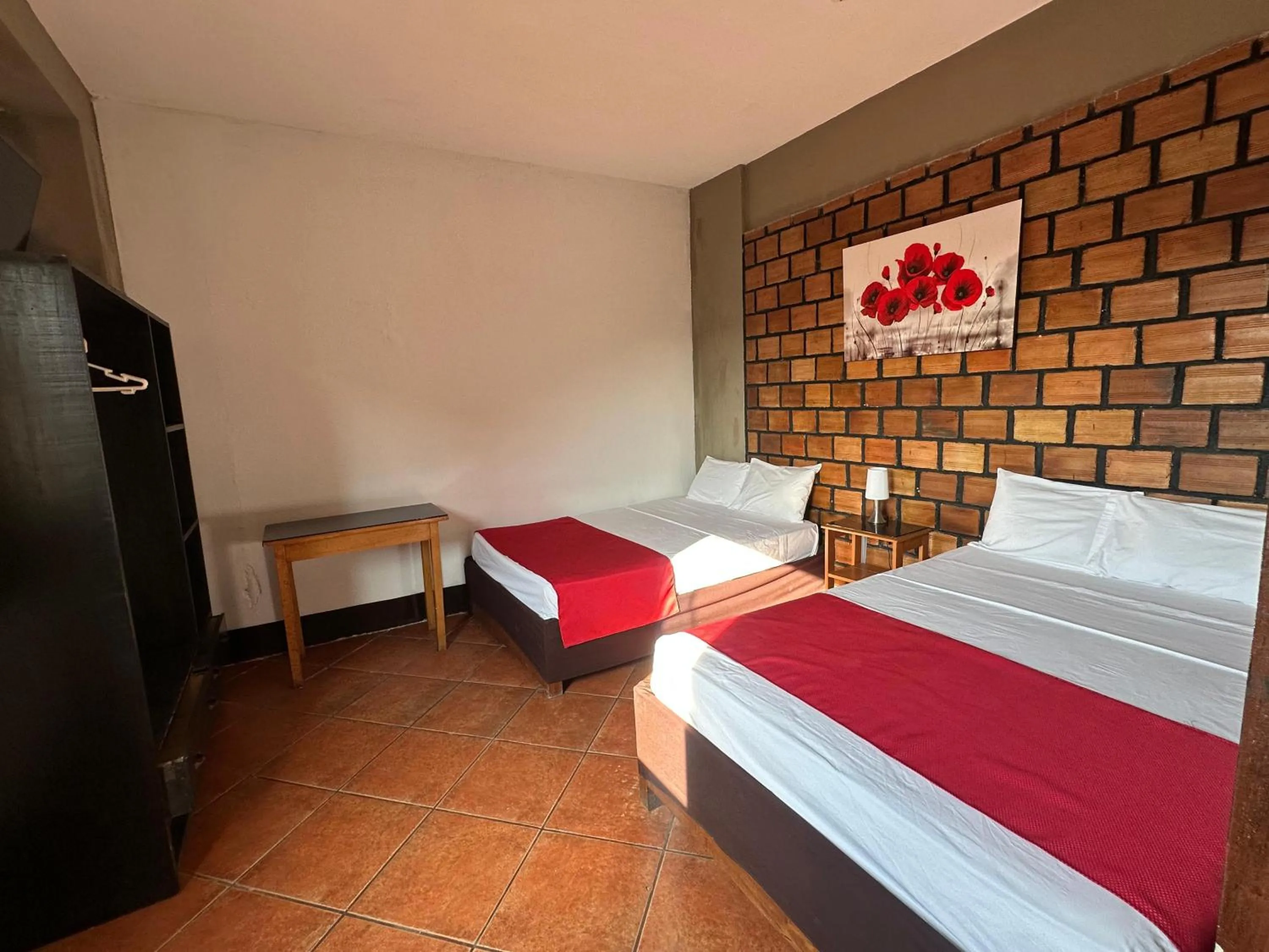 Bedroom, Bed in La Posada del Cauchero Hotel & Suites