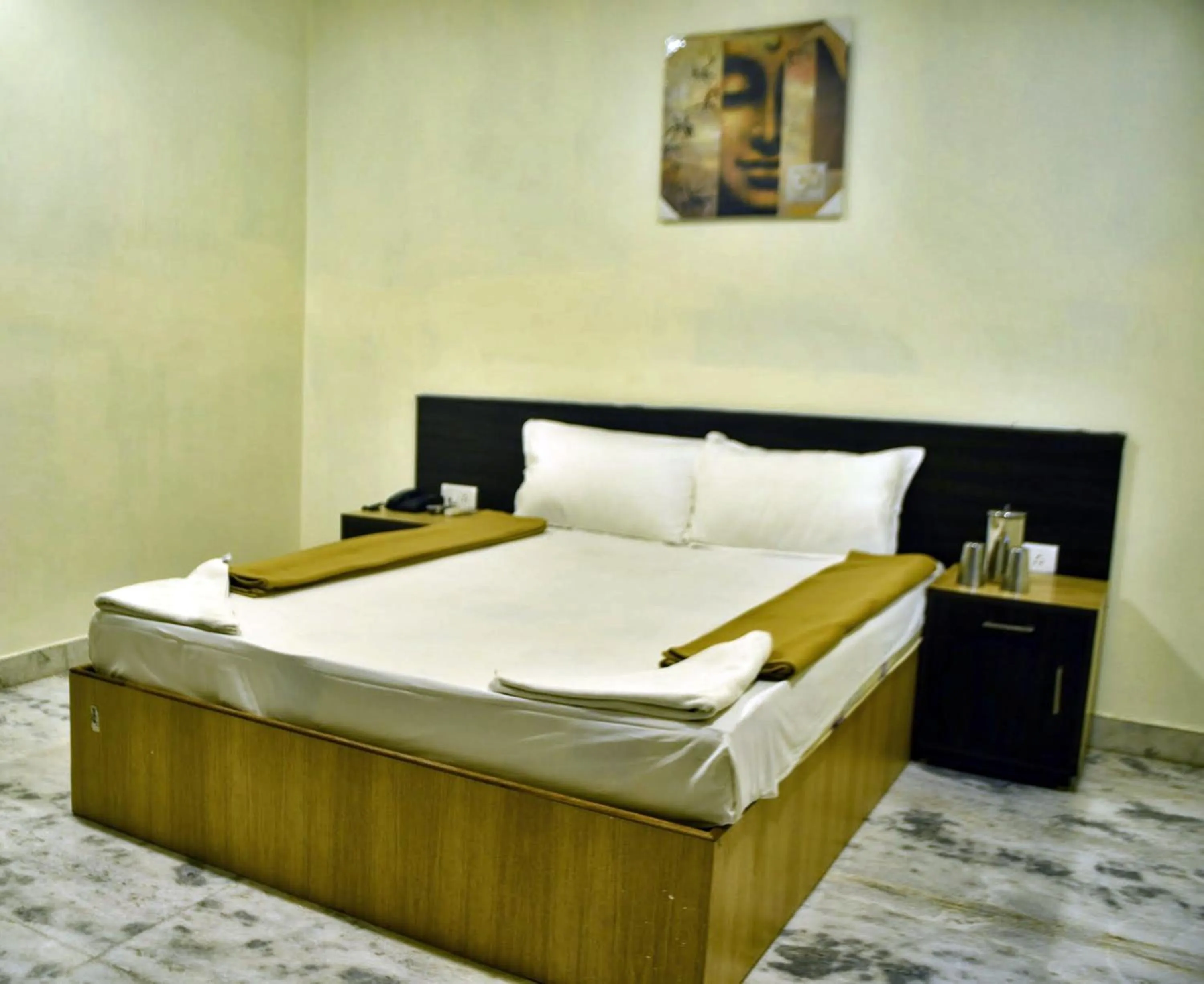 Bed in Hotel Arunachala