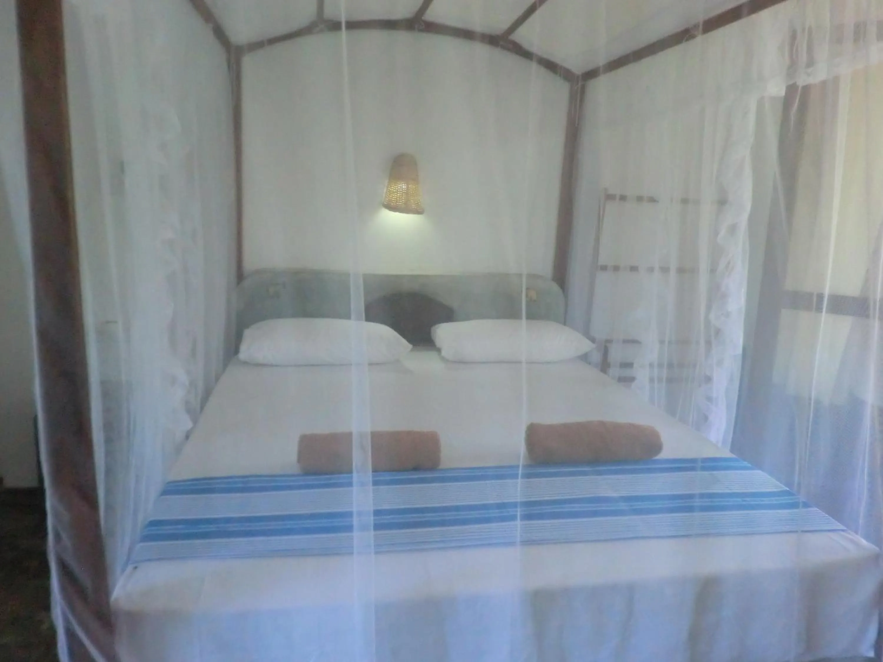 Bed in Peacock Wings Guest