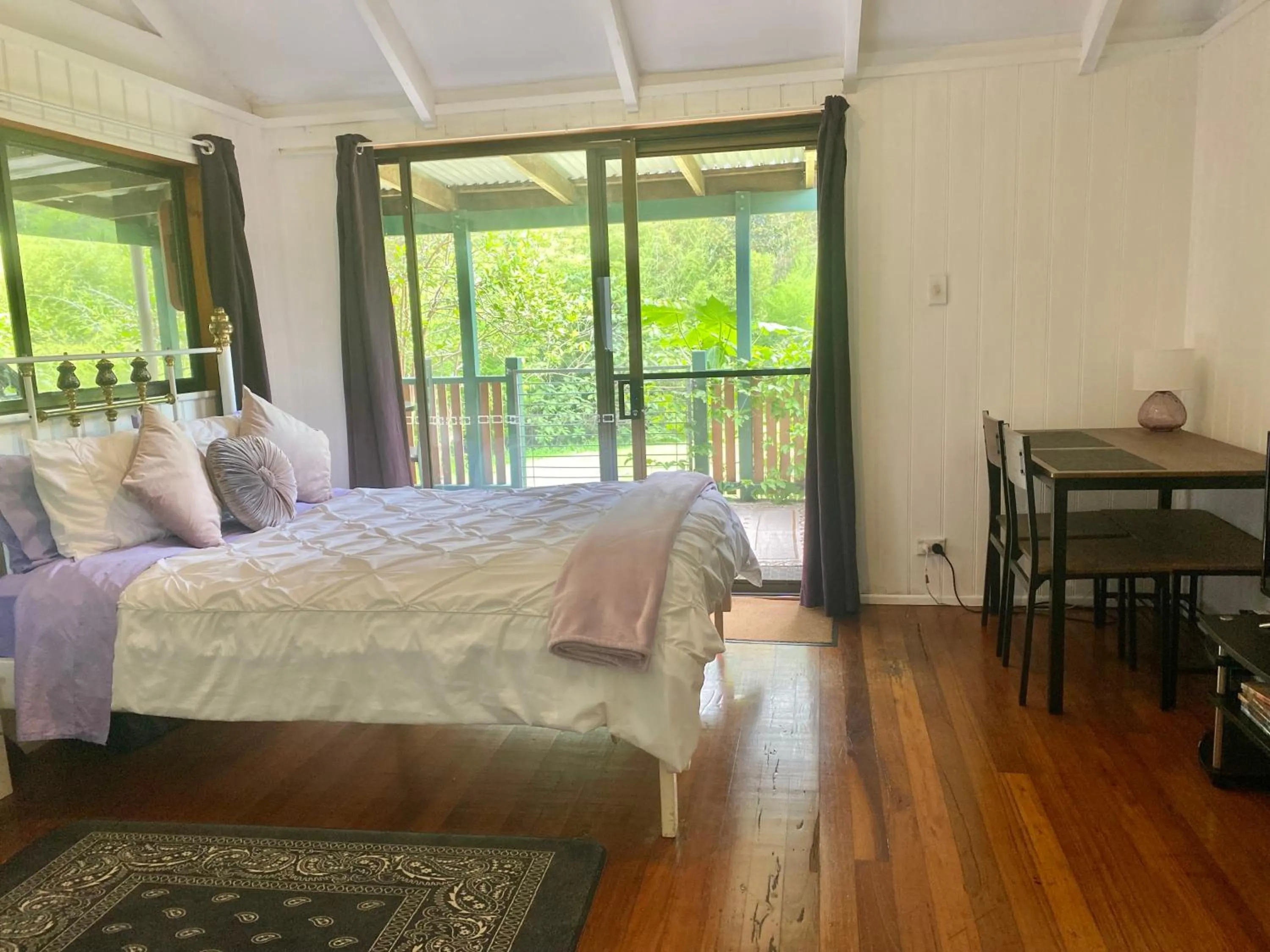 Bed in Nimbin waterfall retreat