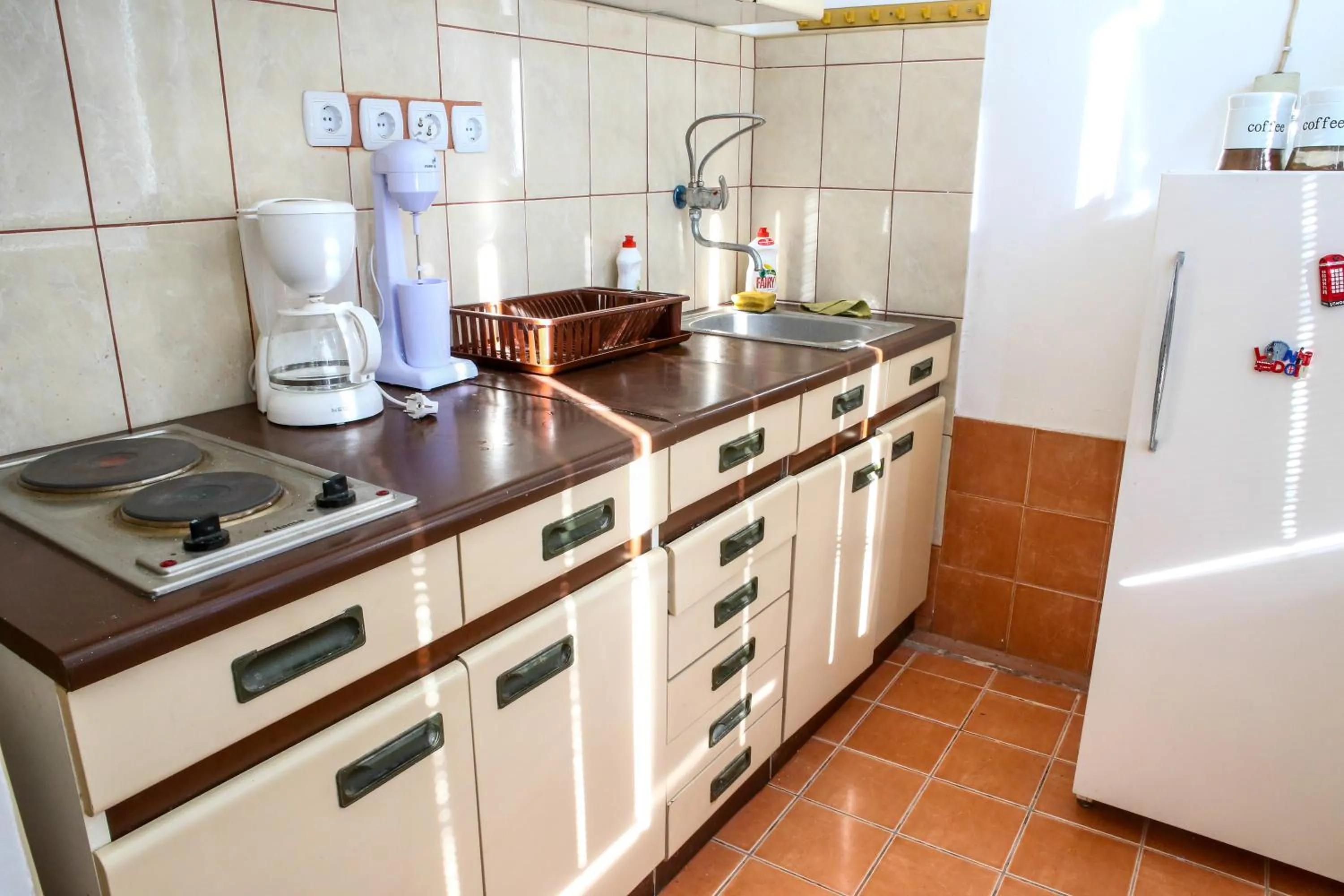 Kitchen or kitchenette in The Comfy Hostel
