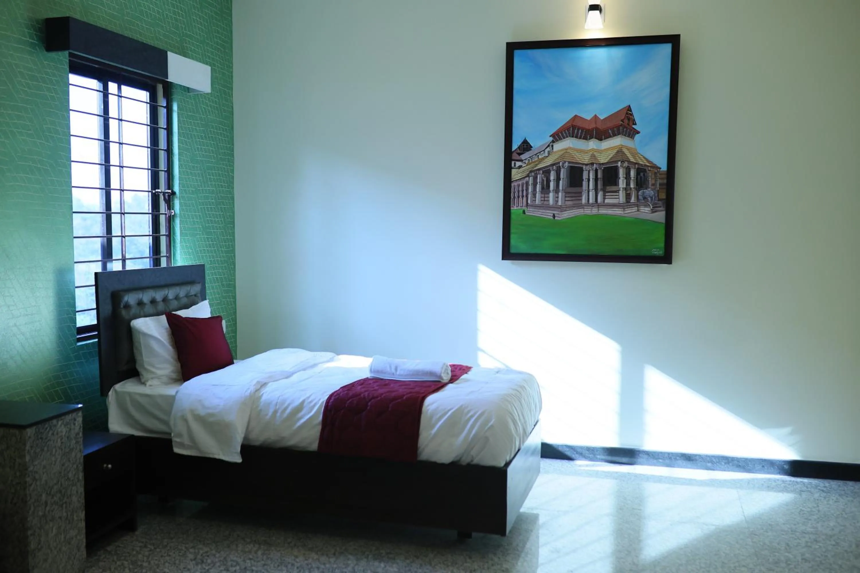 Bed in Hotel Ashlesh Manipal