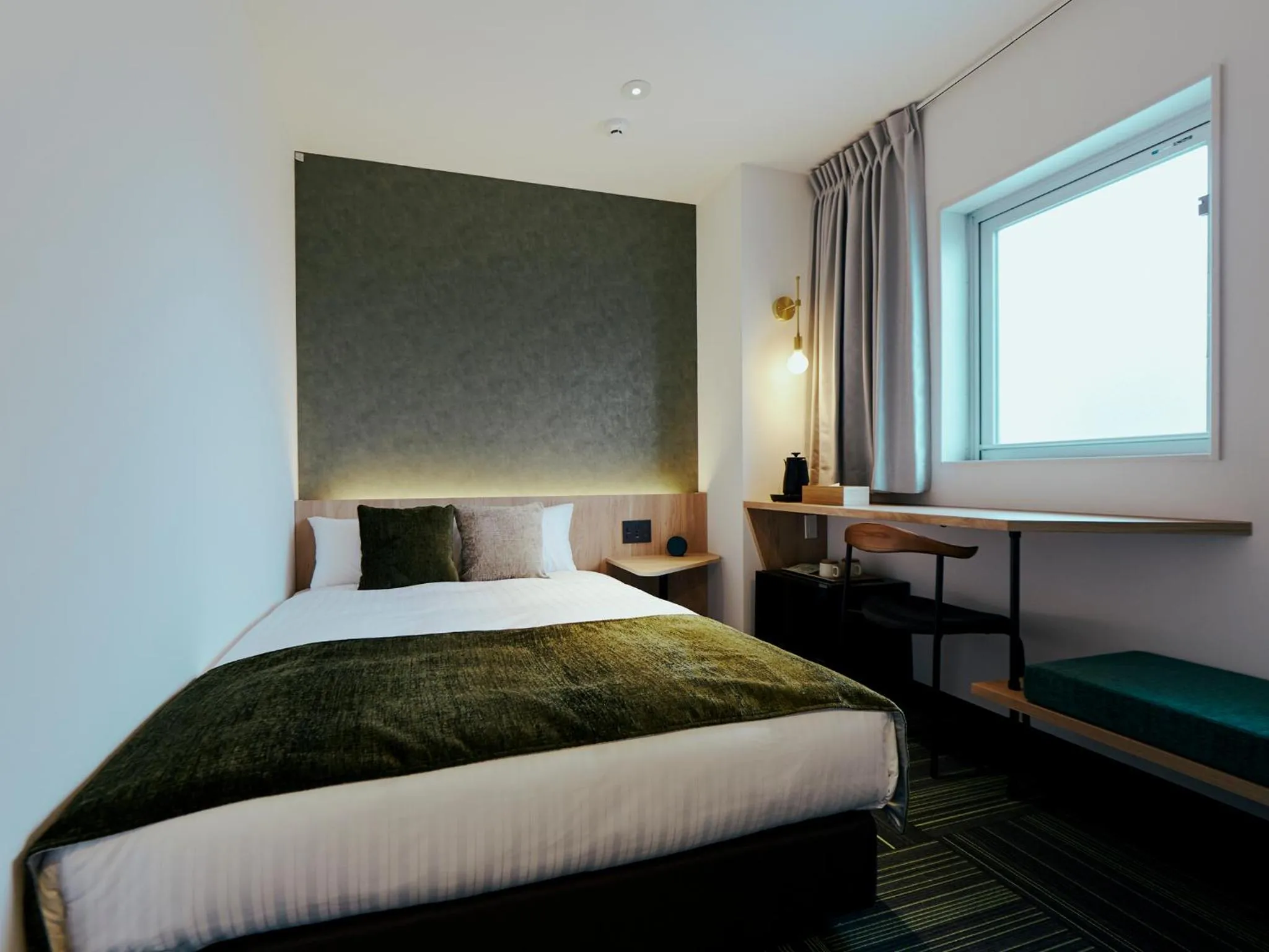 Bed in R Hotel Kansai Airport