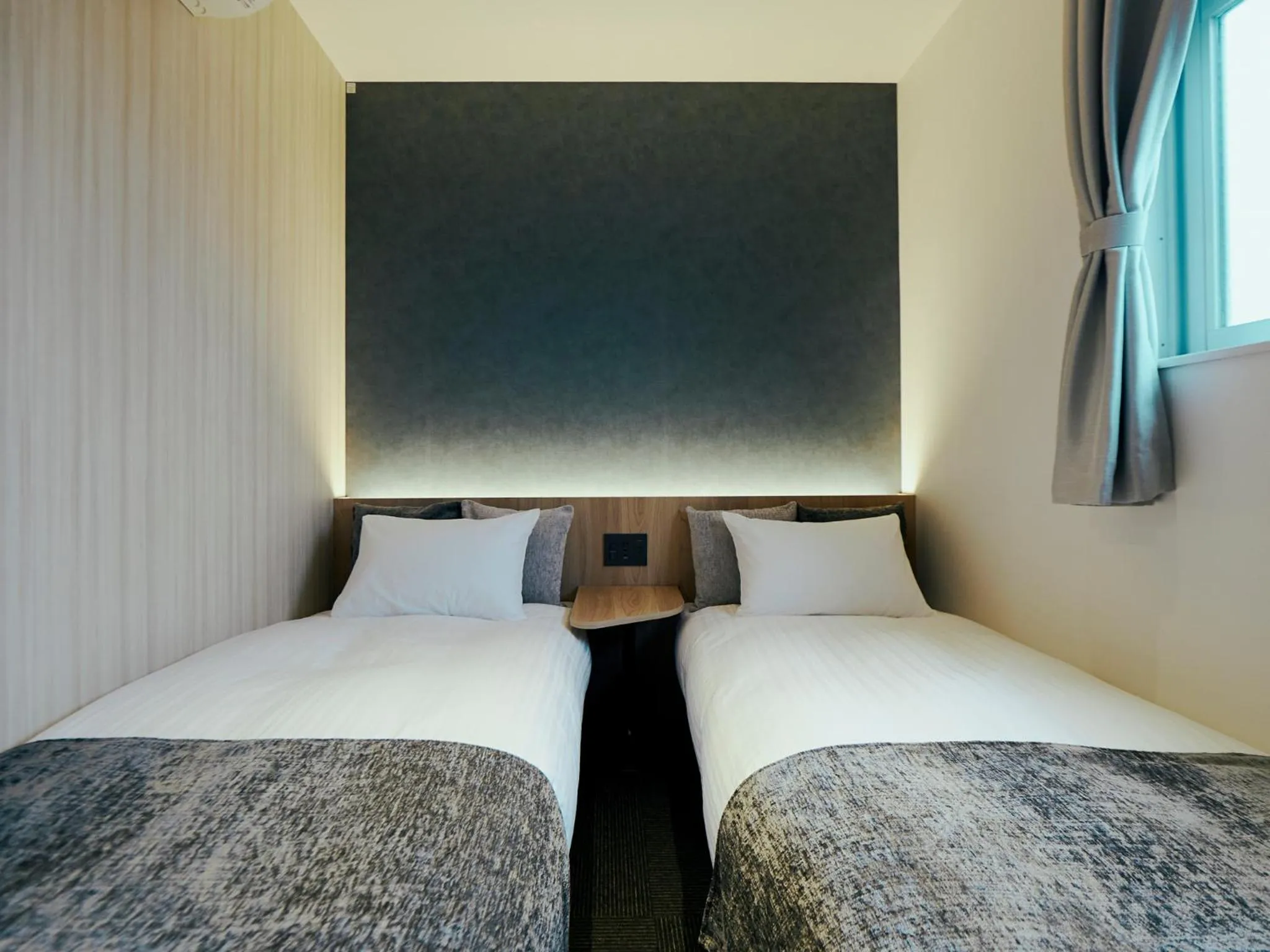 Bed in R Hotel Kansai Airport
