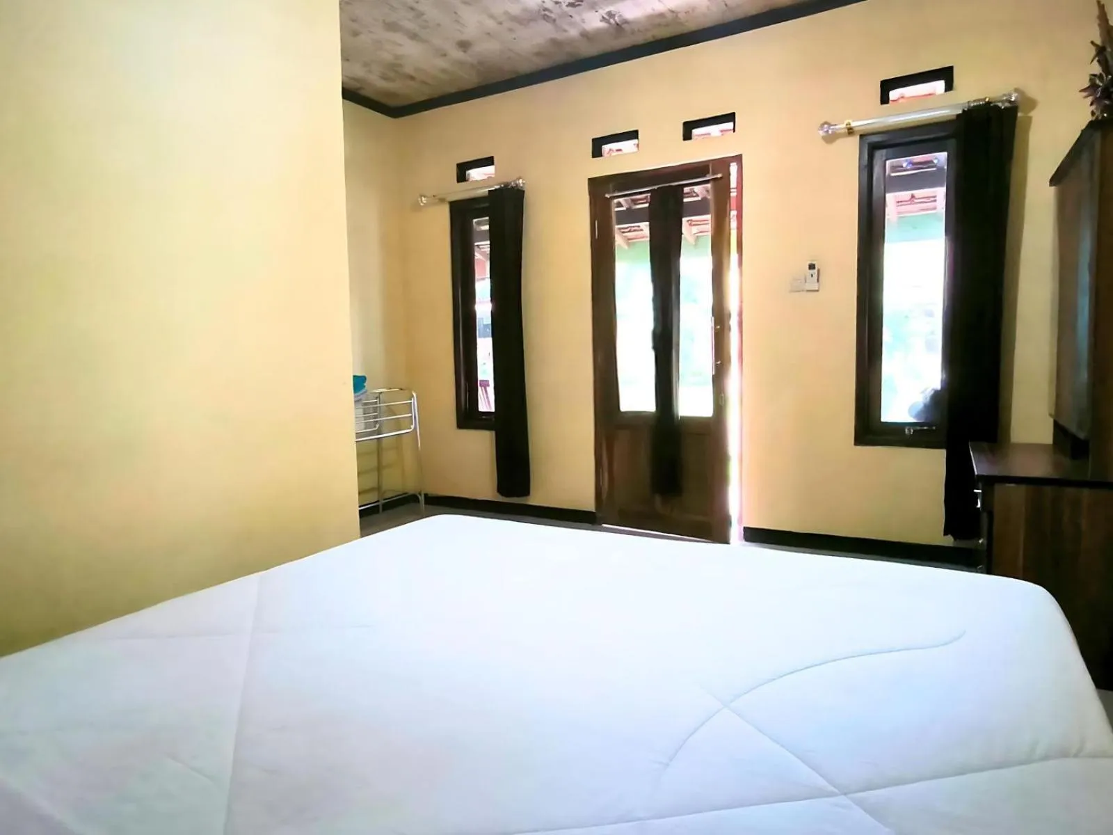 Bed in Villa Setumbu powered by Cocotel