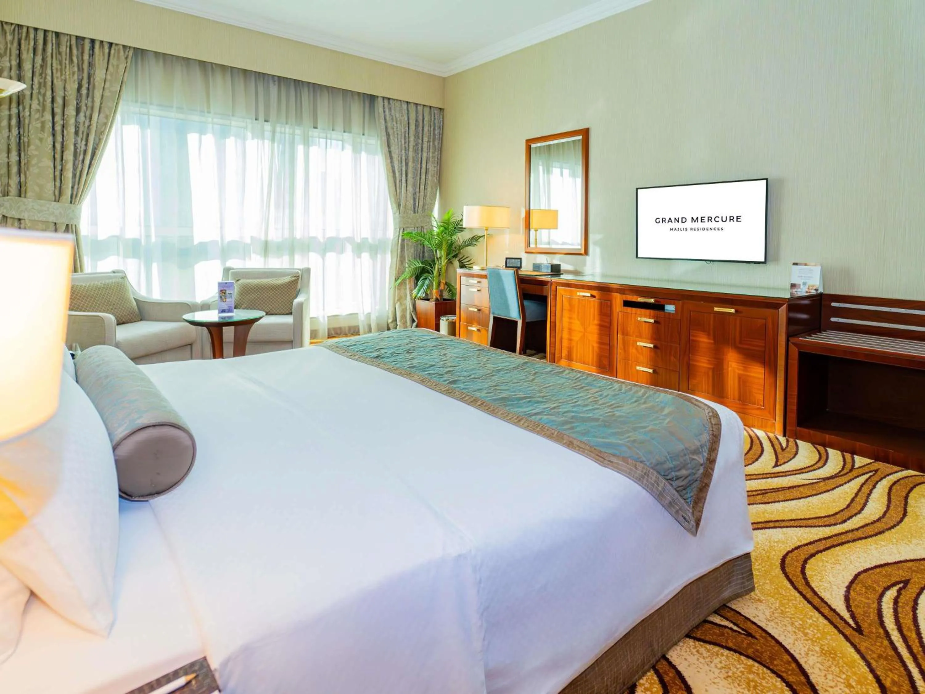 Bed in Grand Mercure Majlis Residences Abu Dhabi