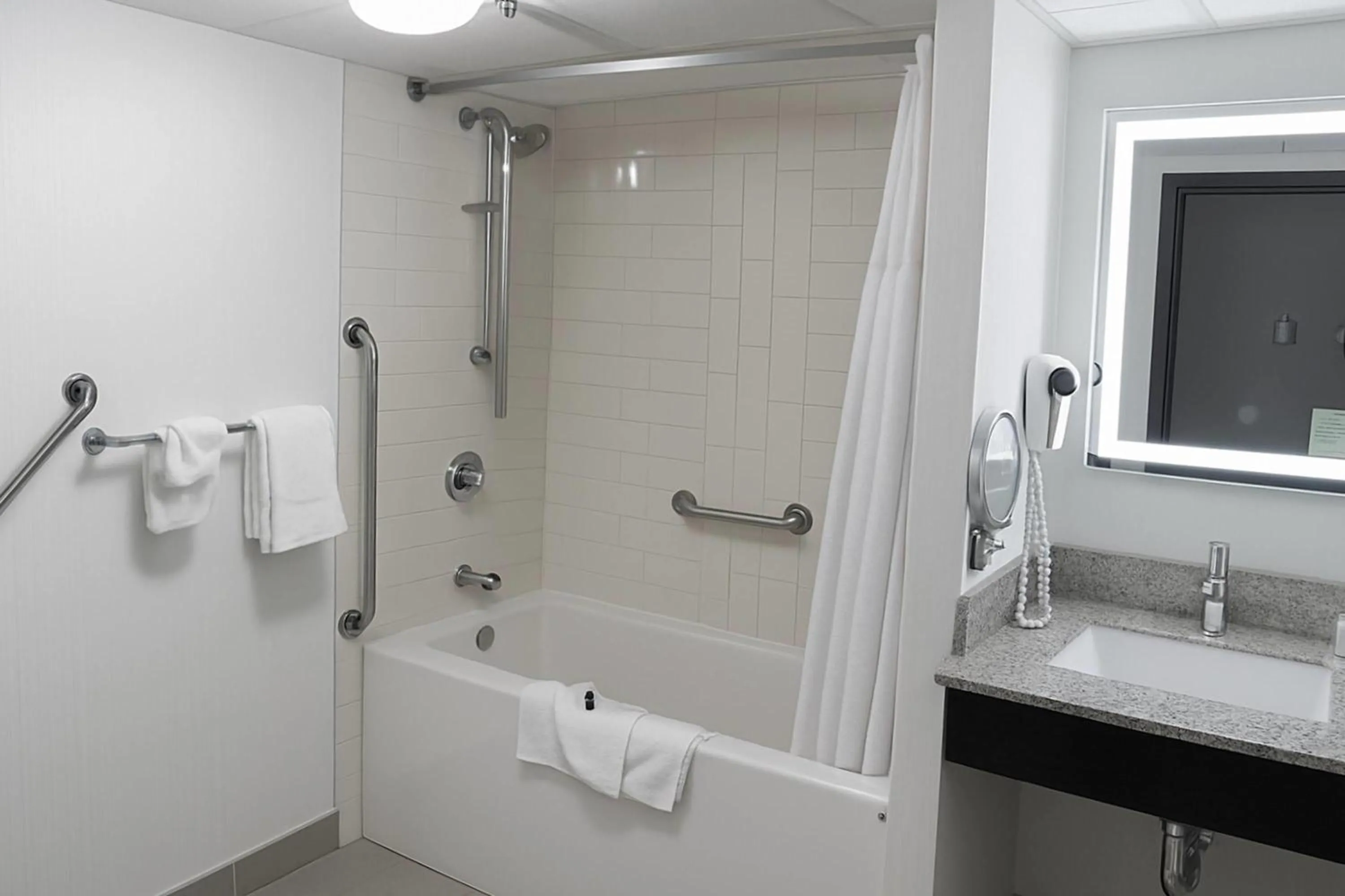 Bathroom in Ramada Plaza by Wyndham Regina Downtown